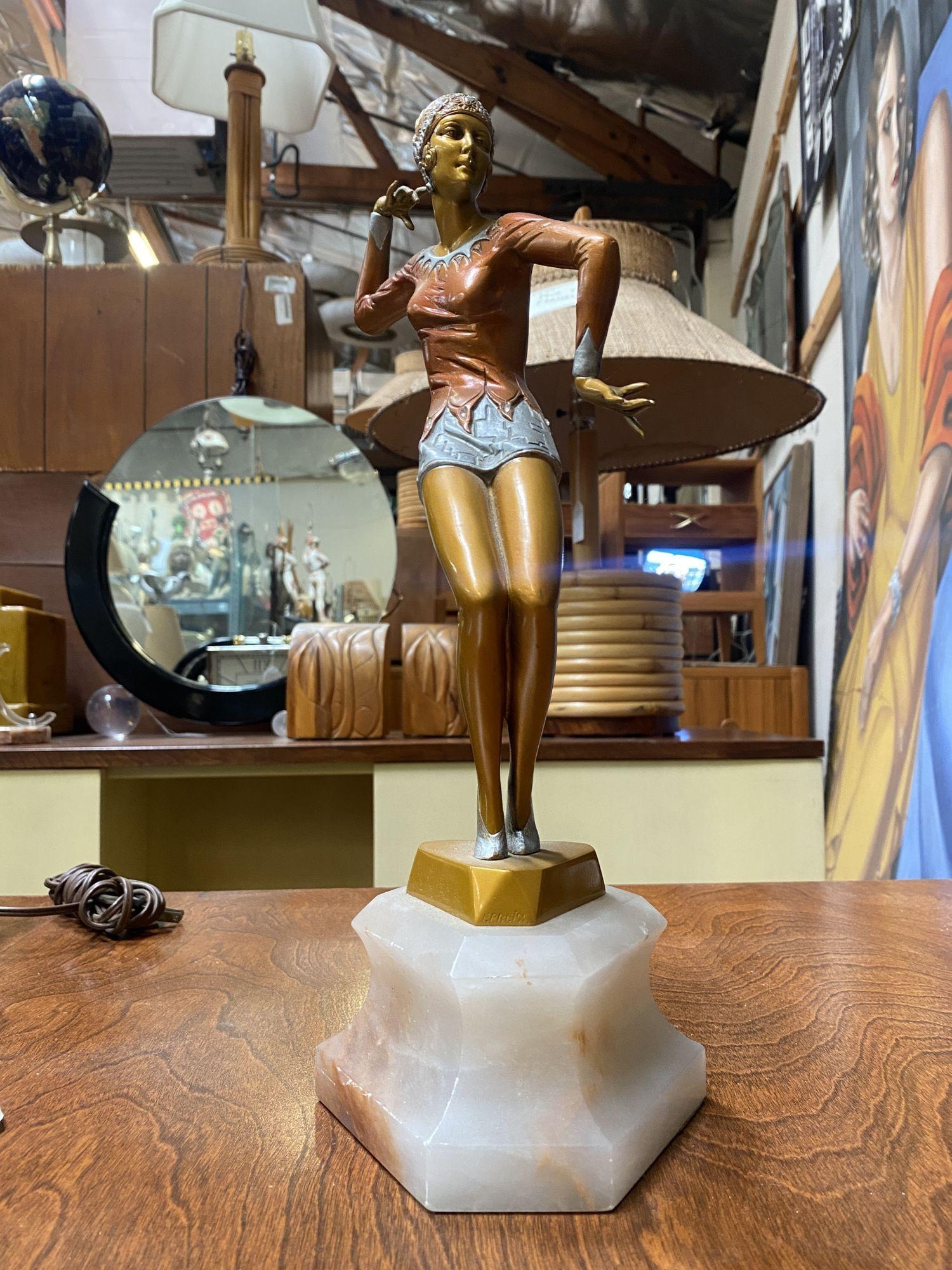 Neo Art Deco copper-tone female flapper dancer statue dancer fixed to an alabaster base, signed Biess. 
 
Circa 1980.