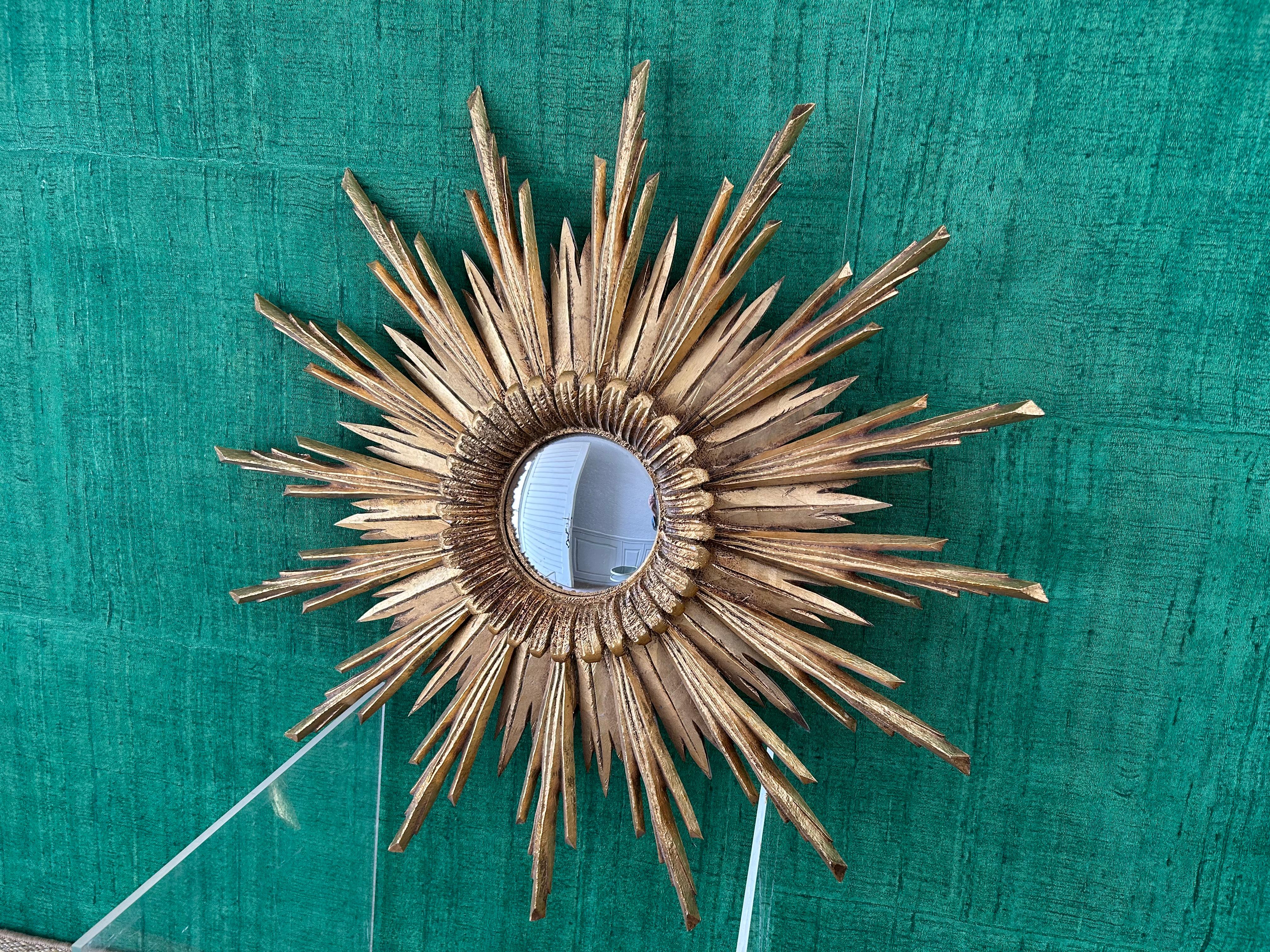 This remarkable vintage sunburst convex mirror certainly ads a touch grandeur and extravagance to interior decoration!

We sourced this in southern Bavaria and it is very much in the neo-baroque style of the chapels and small churches built in the