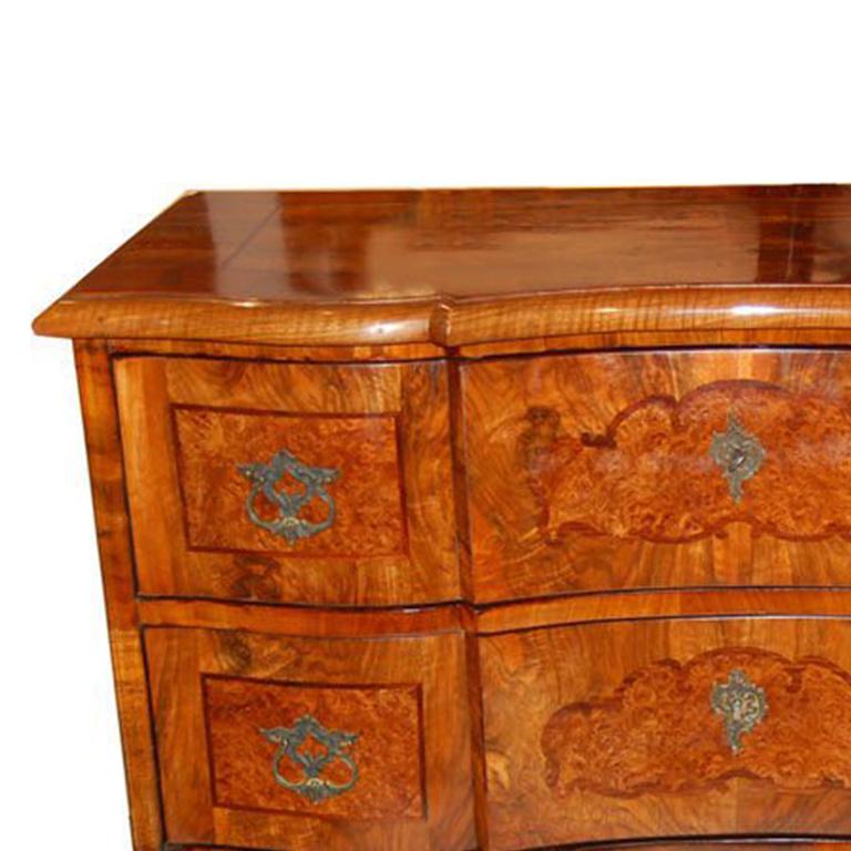Neo Baroque Commode made of exotic walnut.  Commode has  three large drawers and brass hardware.  Austria circa 1870.