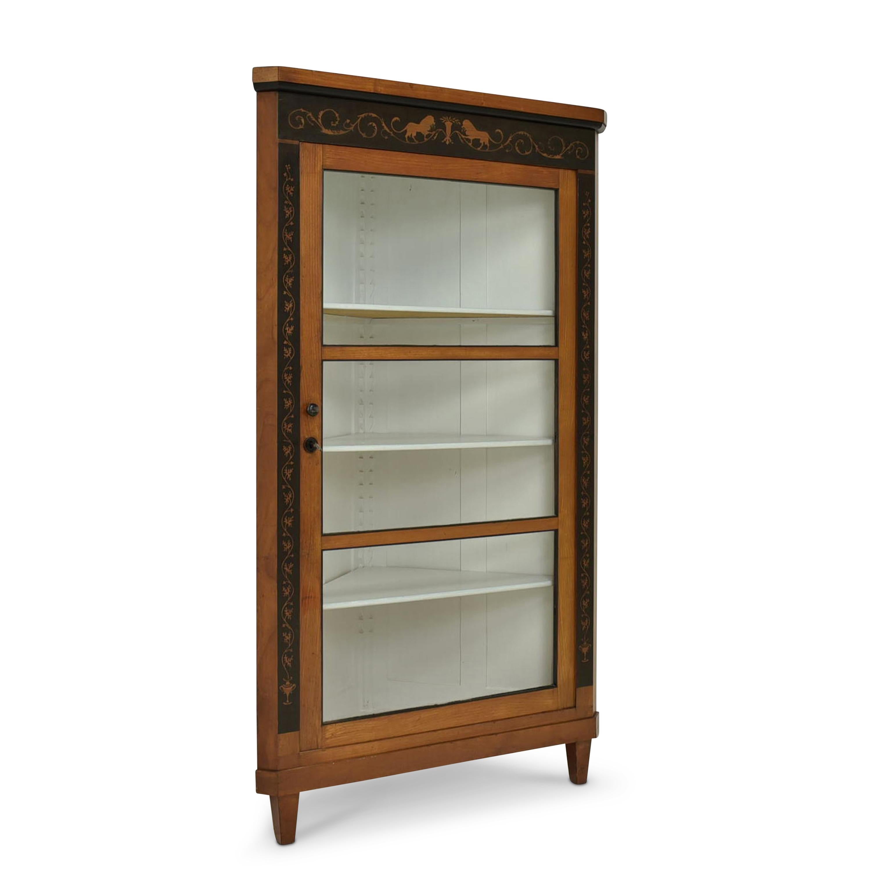 Corner showcase restored Neo-Biedermeier around 1890 ebony corner cabinet

Features:
Interior painted white
Single-door model with three shelves
High quality
Height-adjustable shelves
Original glazing
Very nice patina
Very beautiful inlaid