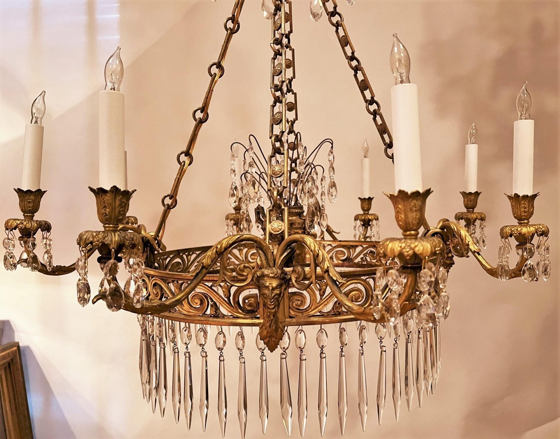 This stunningly delicate-looking 8-light chandelier is light and airy, with rich, hand-cast gilt bronze fittings that exhibit the beautiful patina of nearly 2 centuries of care and use. The hand-cut crystal prisms are period and throw off an