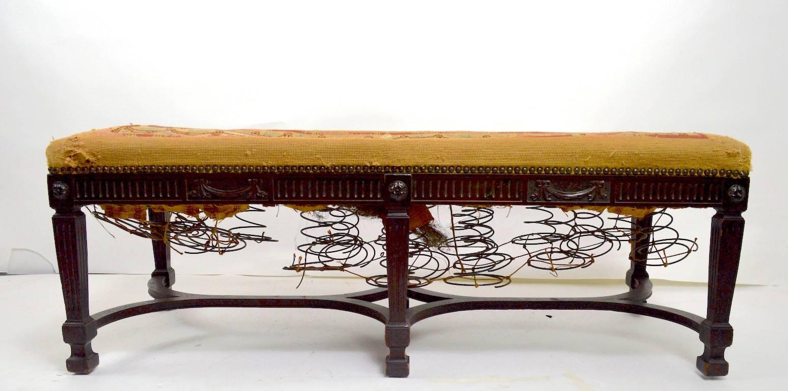 Nice Adam (Federal) style bench with tapestry fabric top (worn). This example will need to be reupholstered, it is structurally sound and sturdy, and in original finish (missing one decorative rosette). Great classical style, circa 1920s.