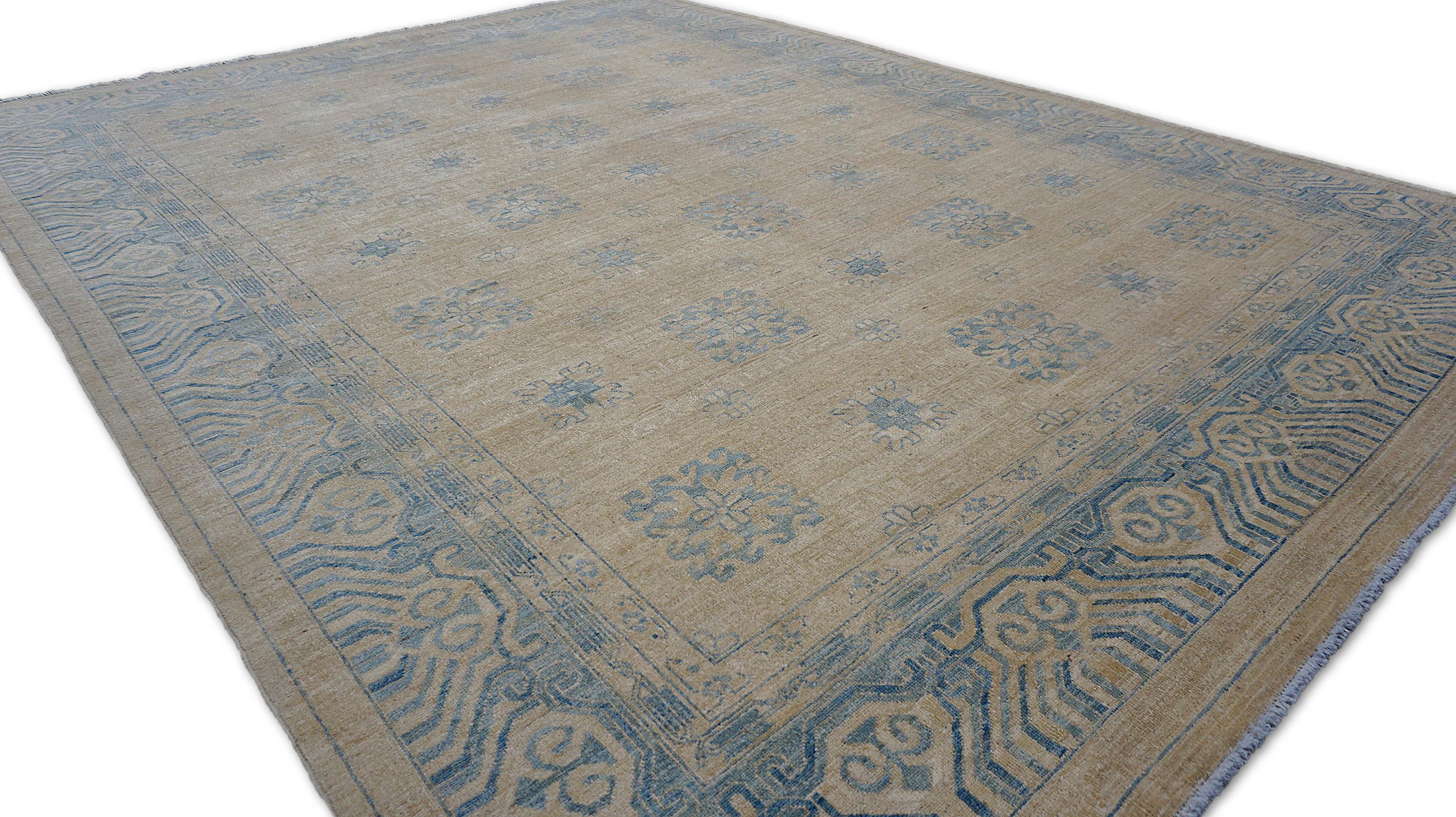 This exquisite hand-knotted rug showcases a refined geometric design, meticulously crafted from premium hand-spun wool. The field features a subtle grid of floral medallions and stylized rosettes, each intricately detailed in soft sky blue against a