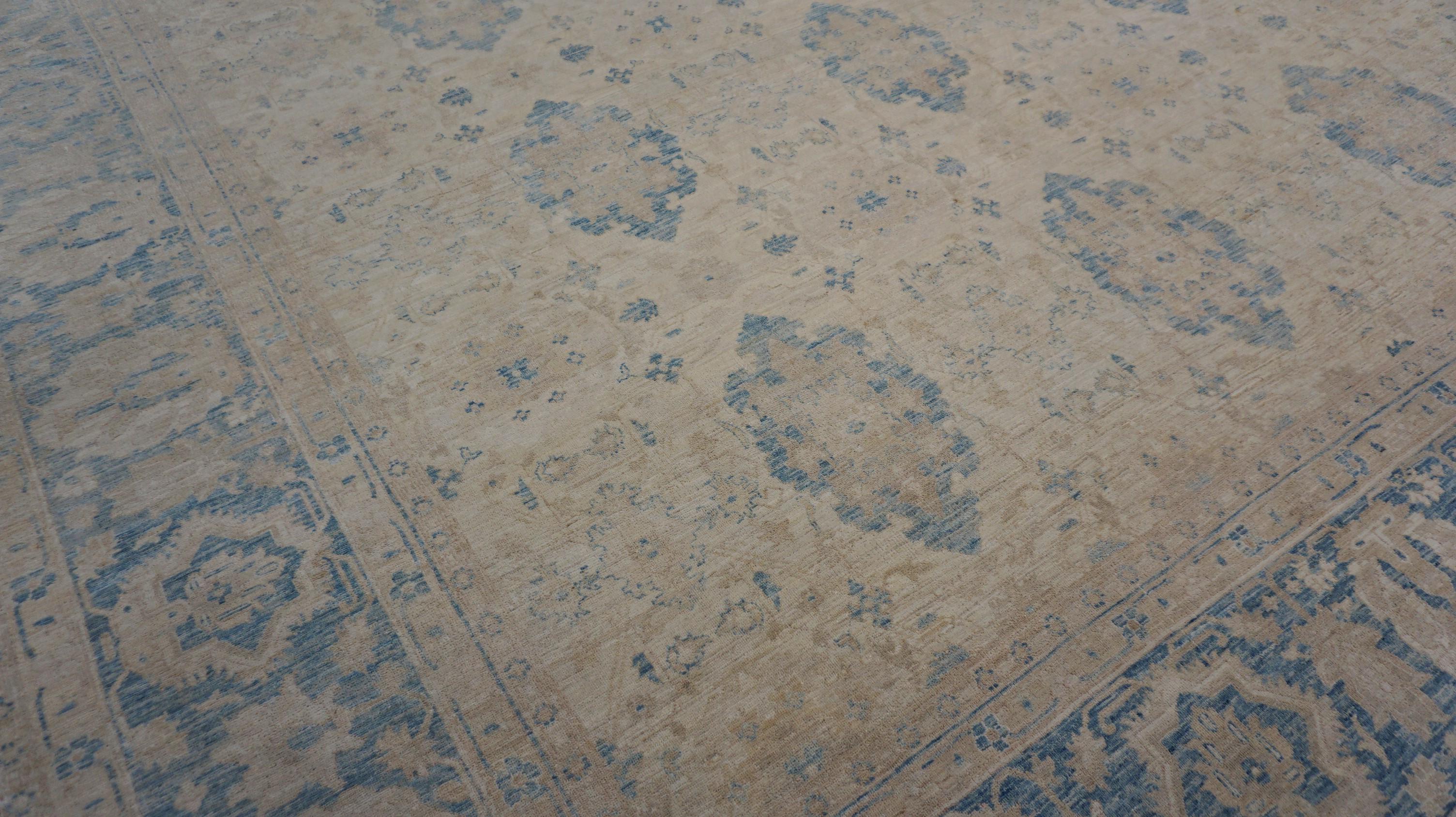This exquisite hand-knotted wool Ziegler Sultanabad design rug showcases refined craftsmanship and a timeless aesthetic inspired by traditional Persian designs. Woven from high-quality wool, this rug features a delicate palette of soft beige and