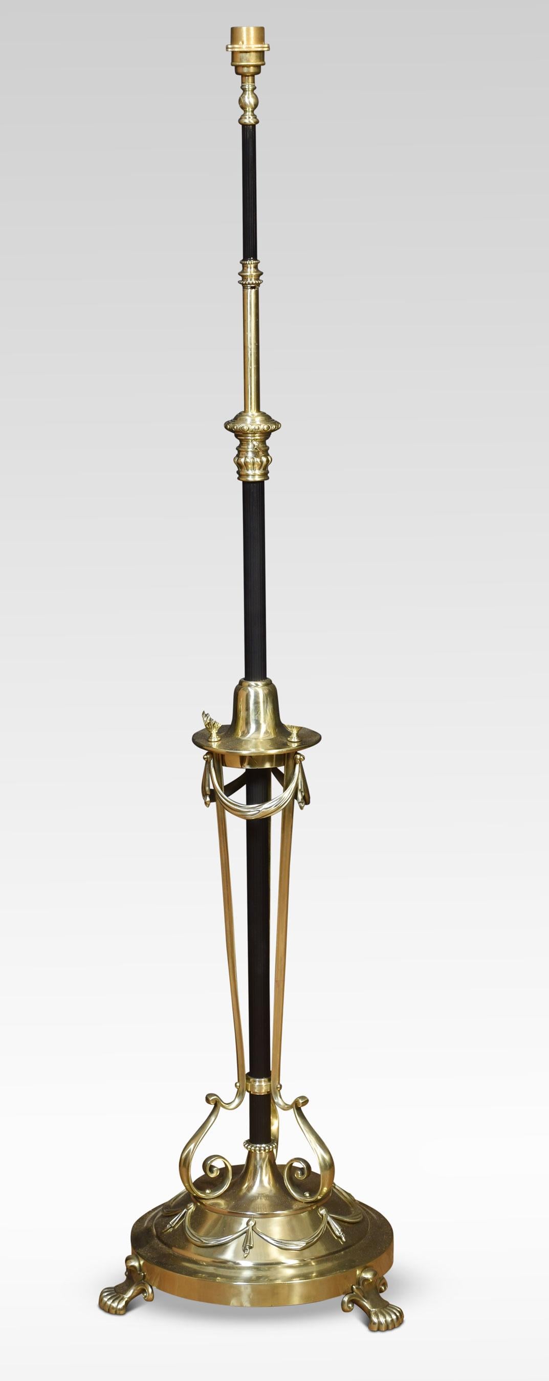 Brass standard lamp, with central ebonised brass column supported with scrolling supports. All raised up on a circular base with swag decoration terminating in paw feet.
Dimensions
Height 57 Inches when extended 68 Inches
Width 15 Inches
Depth