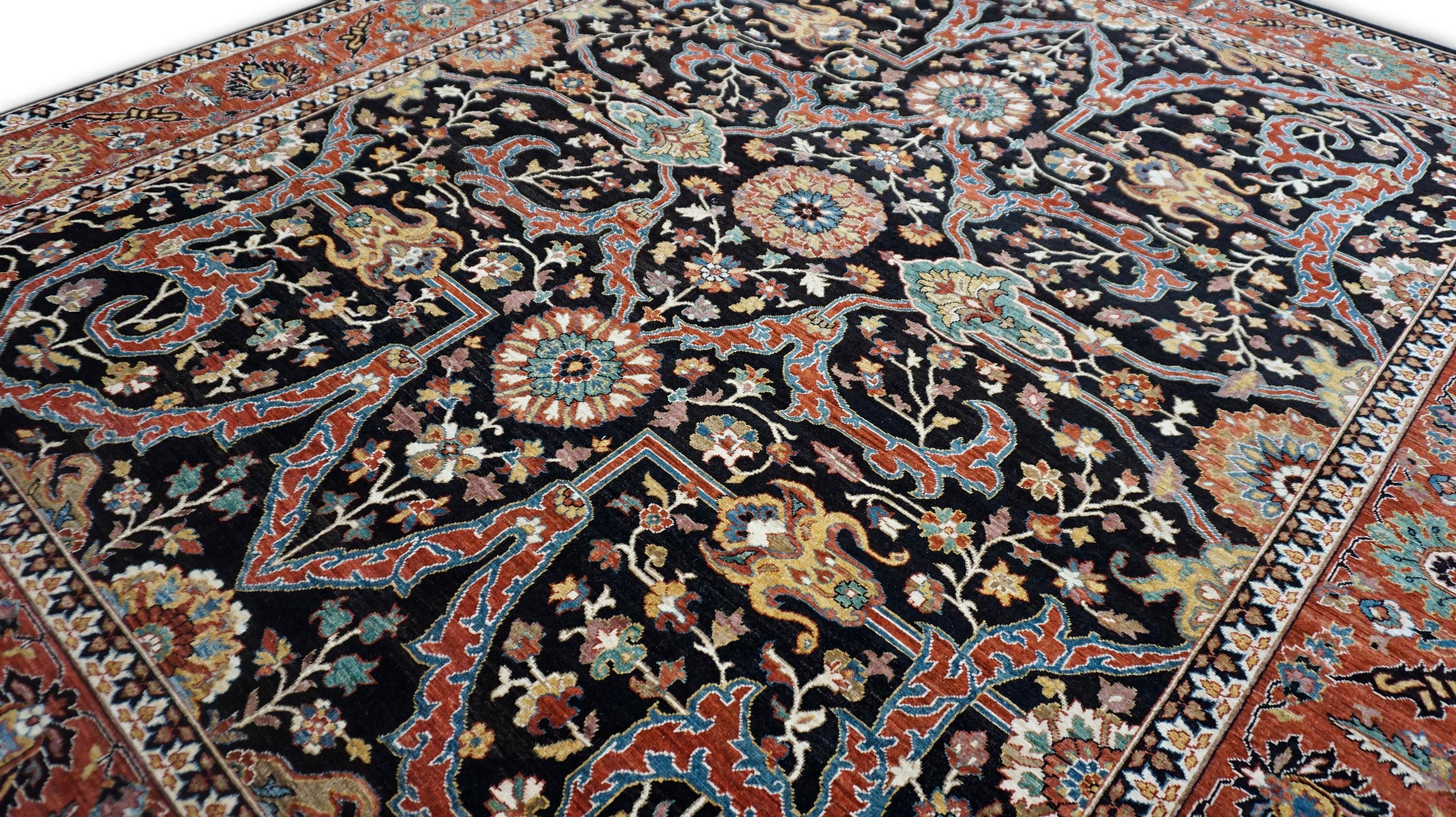 This rug is a hand-knotted Isfahan-style carpet, inspired by the legendary designs. Woven with meticulous precision using hand-spun wool and natural dyes, the rug showcases a dramatic medallion and corner layout (medallion-and-spandrel format) on a