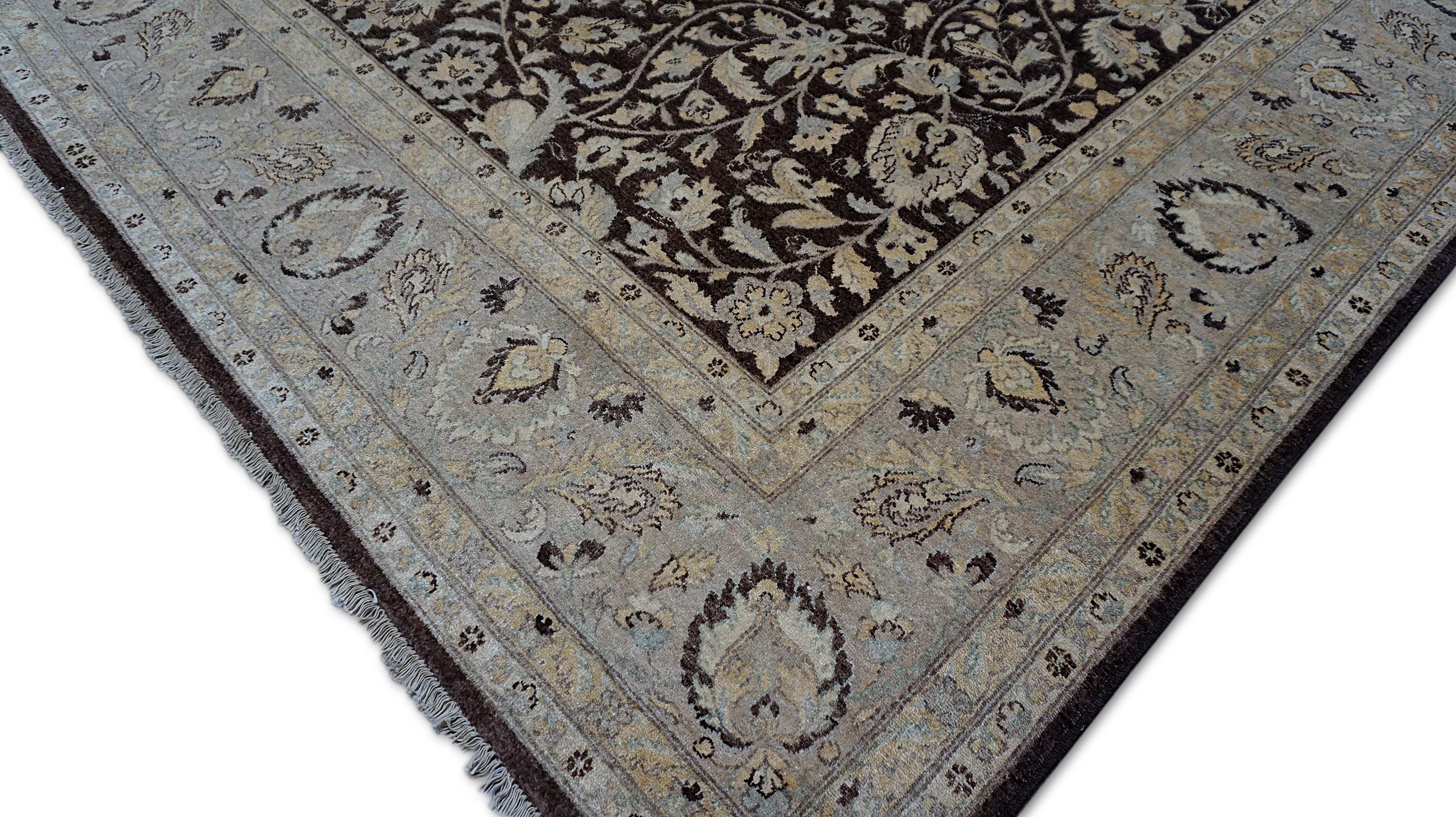 This exquisite hand-knotted Sultanabad rug captures the essence of classic Persian artistry with its richly detailed floral medallion design. The deep brown field provides a striking backdrop for intricate ivory vine motifs and floral elements with