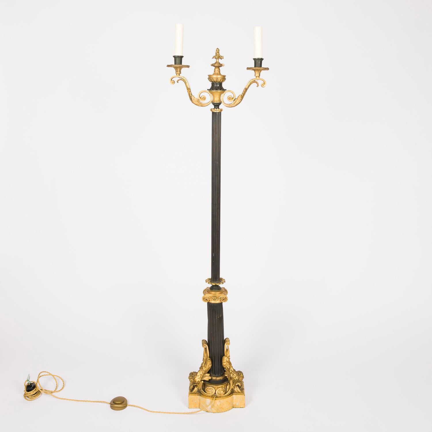 A French neo-classical gilt bronze, tôle, and Siena marble twin arm standard lamp.

Weighted marble base.

Re-wired and tested.