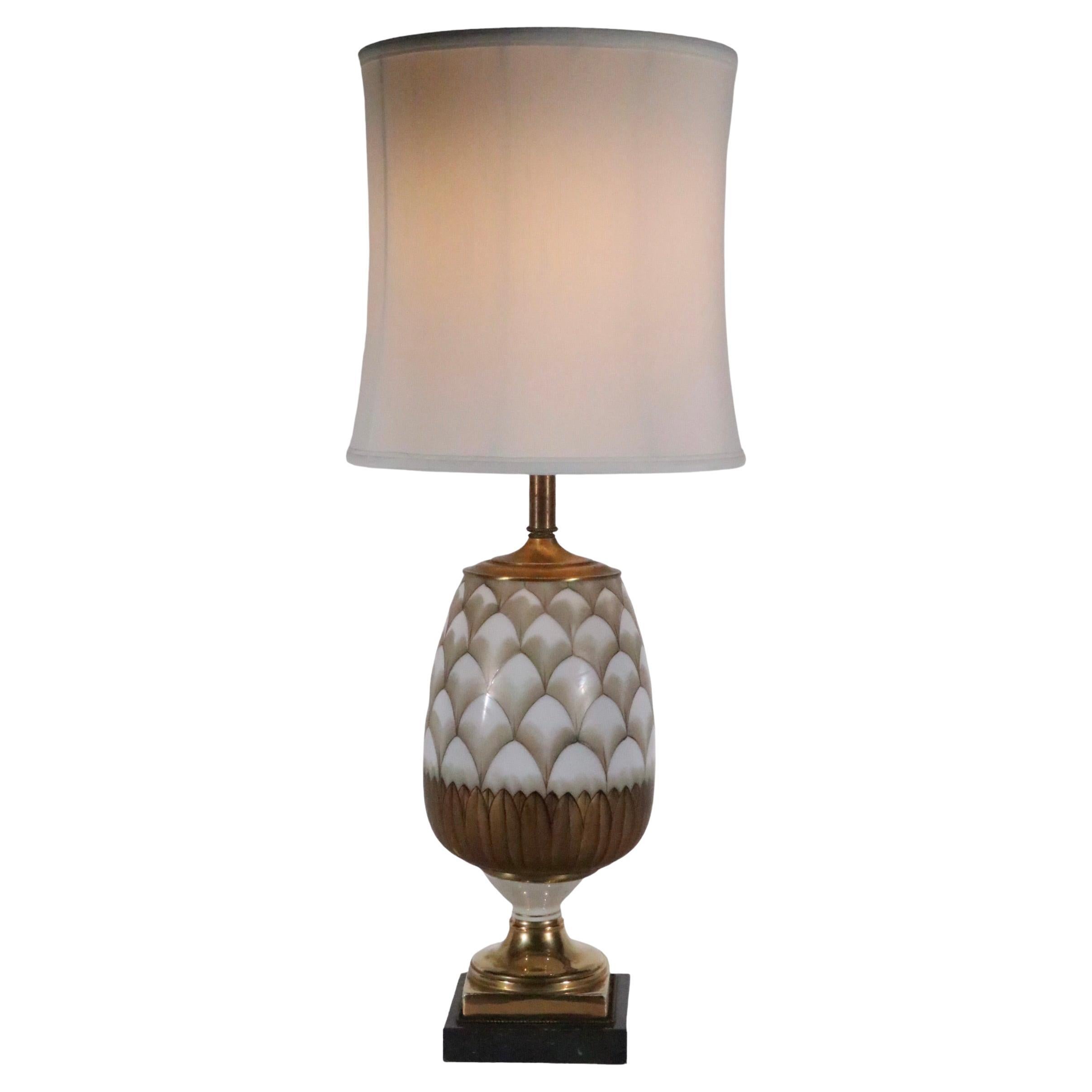 Exceptional decorative table lamp, circa 1940/1960.design attributed to Tommi Parzinger. The lamp features a glass body mounted on a ceramic base, which is mounted on a marble plinth base. The center glass body displays a hand-painted  pattern