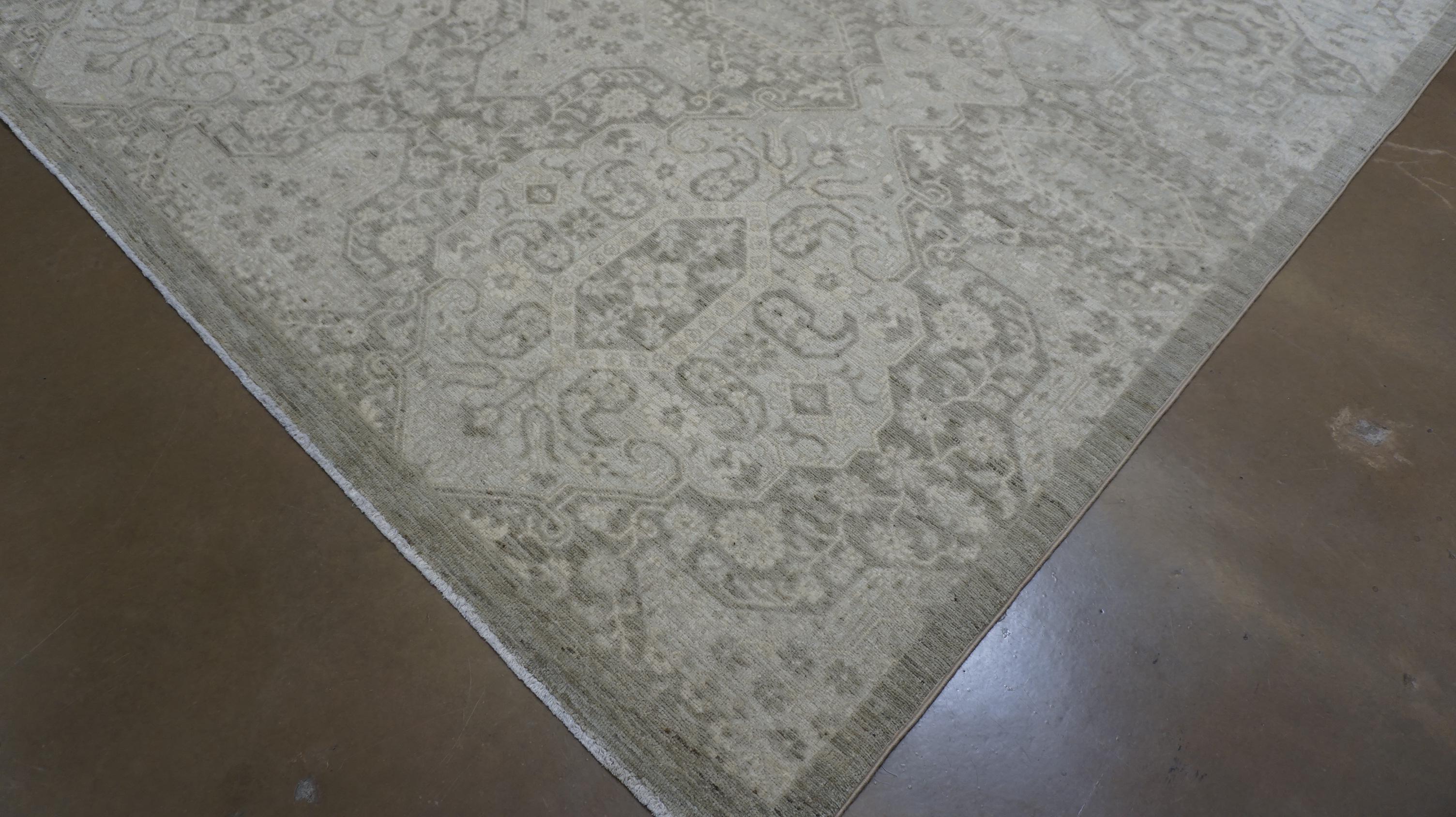 This hand-knotted wool rug presents an intricate medallion and geometric pattern that seamlessly blends classic Persian influences with contemporary styling. Crafted using premium hand-spun wool, this piece showcases a complex lattice of medallion