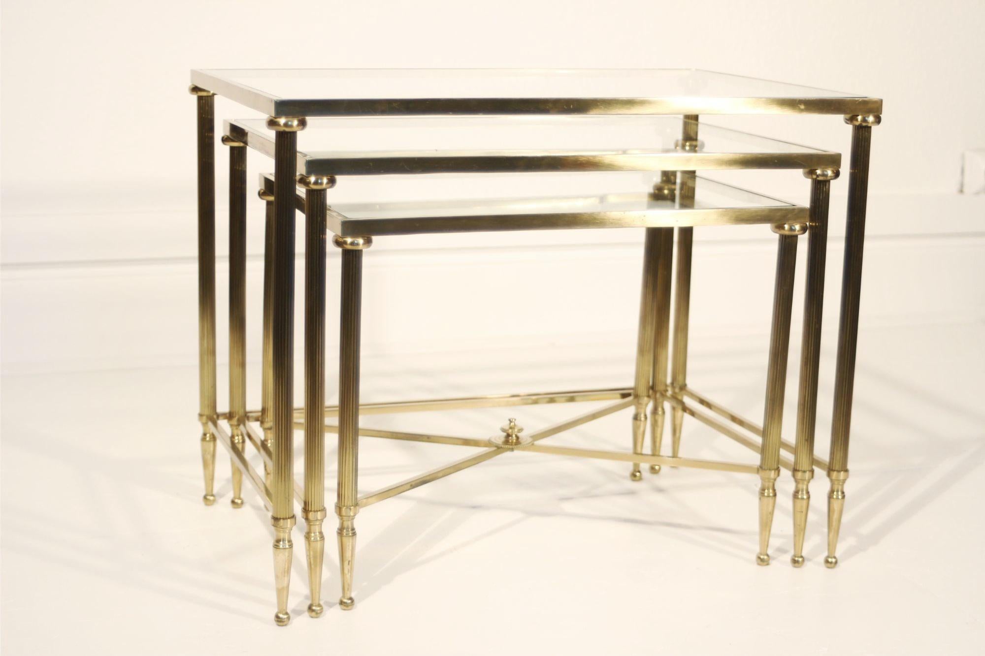 Neoclassical Neo-classical nesting tables in gilded brass & glass by Maison Jansen, France  For Sale