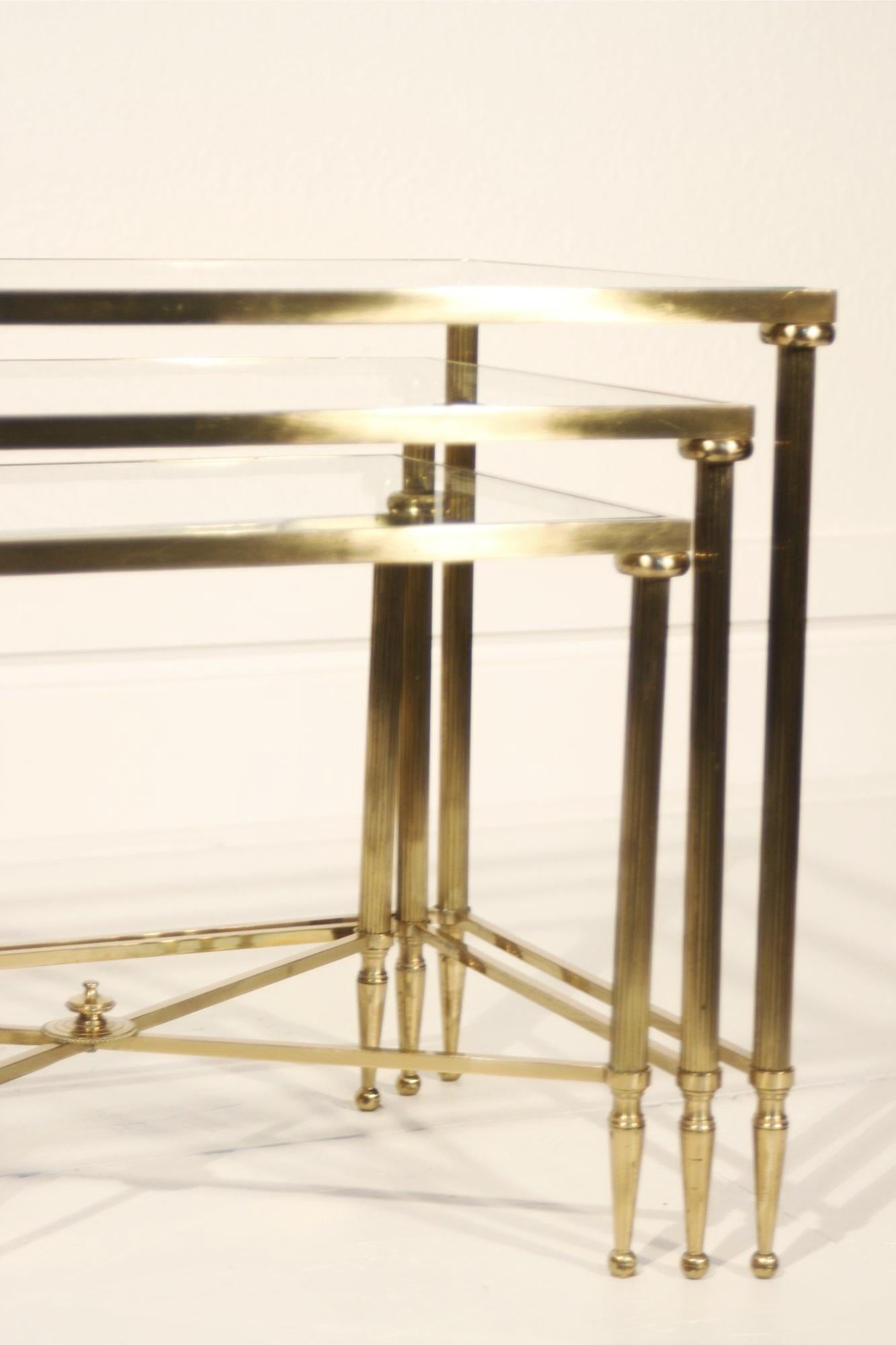 Gilt Neo-classical nesting tables in gilded brass & glass by Maison Jansen, France  For Sale