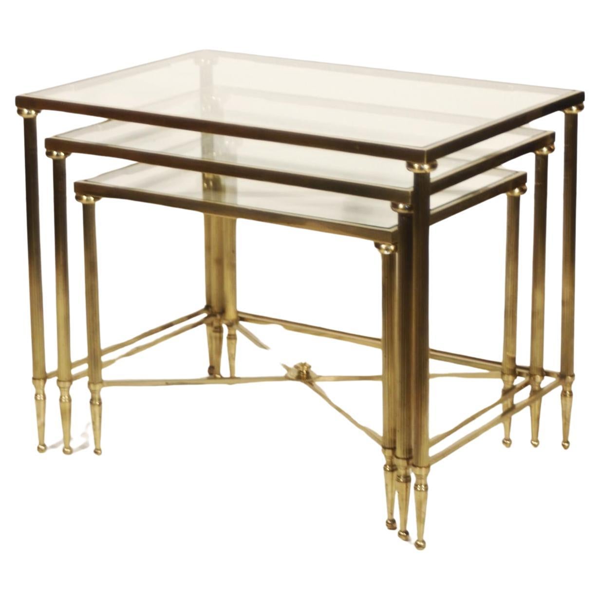 Neo-classical nesting tables in gilded brass & glass by Maison Jansen, France  For Sale