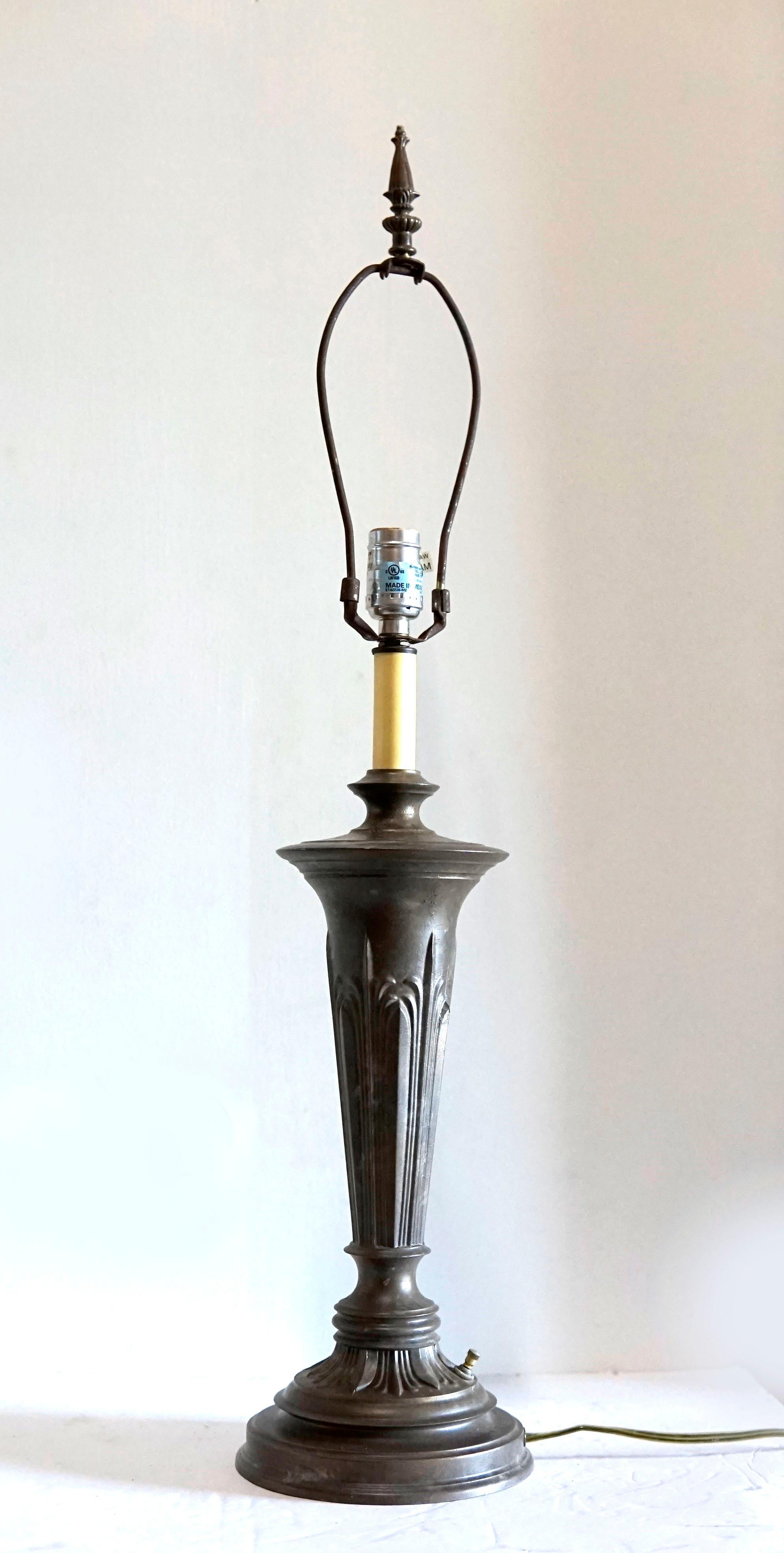 A beautiful patina has developed over the last century on this Neoclassical or Renaissance Revival.bronze table lamp. It is from the 1920s or 1930s and with the proper shade is the definition of statement lighting. It may be reminiscent of art deco,
