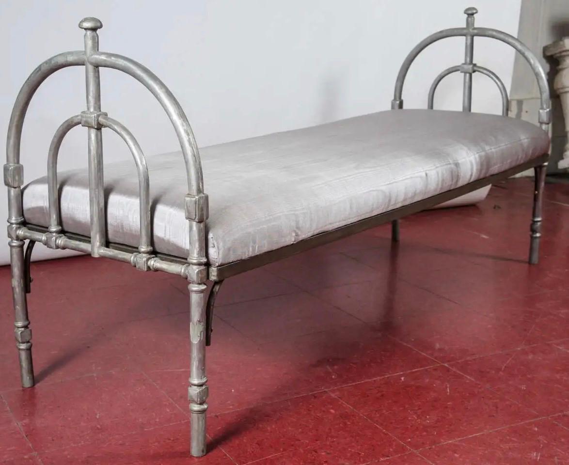 Stylish and elegant pewter colored neoclassical metal bench frame with silver moire upholstered cushion. Perfect for foot of the bed or entry foyer, or any where where you could use extra seating.
Search terms: MCM, classical, Gustavian, Swedish.