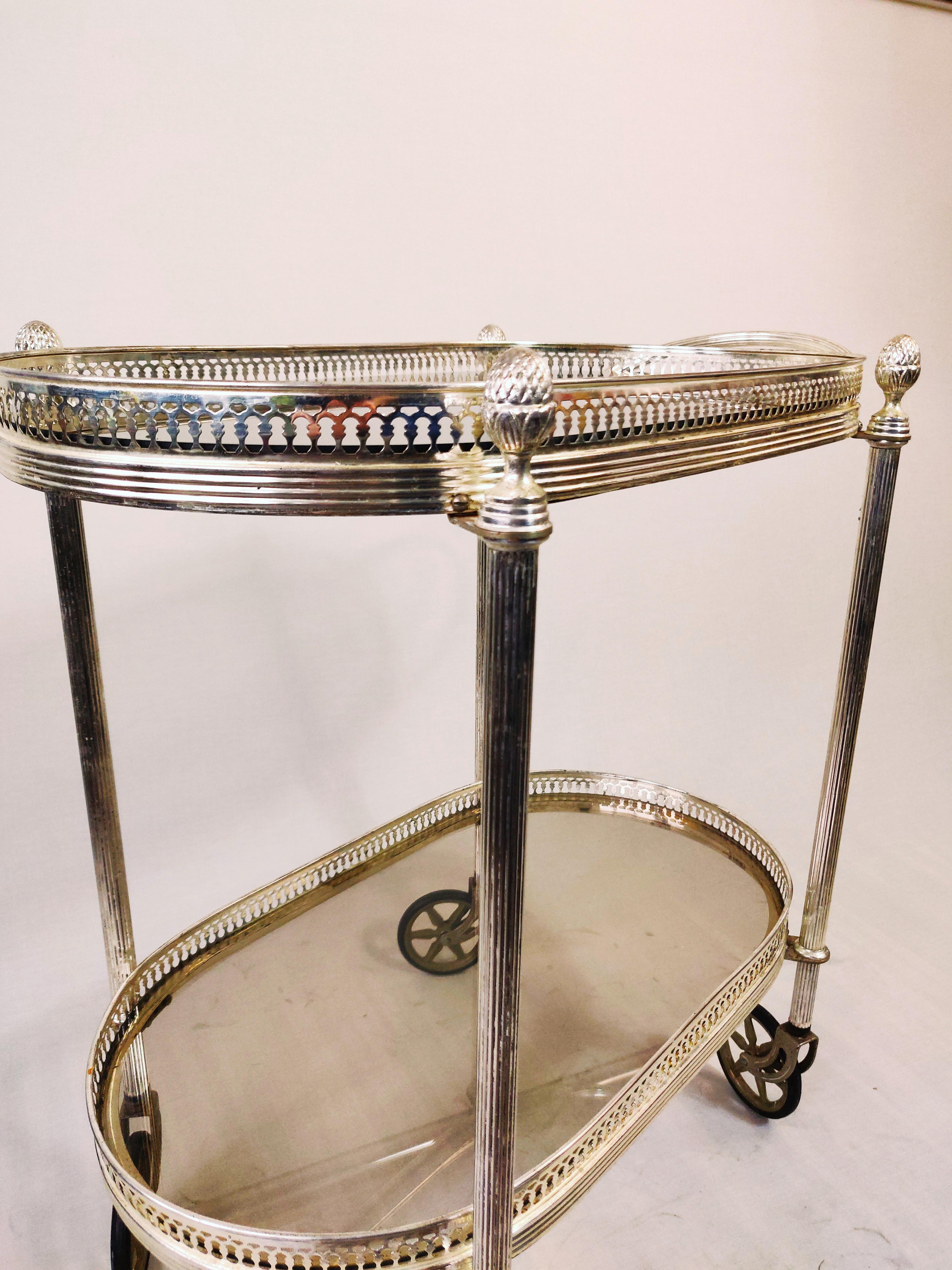 French Neo classical silvered and glas drink trolley in style of Maison Jansen. For Sale