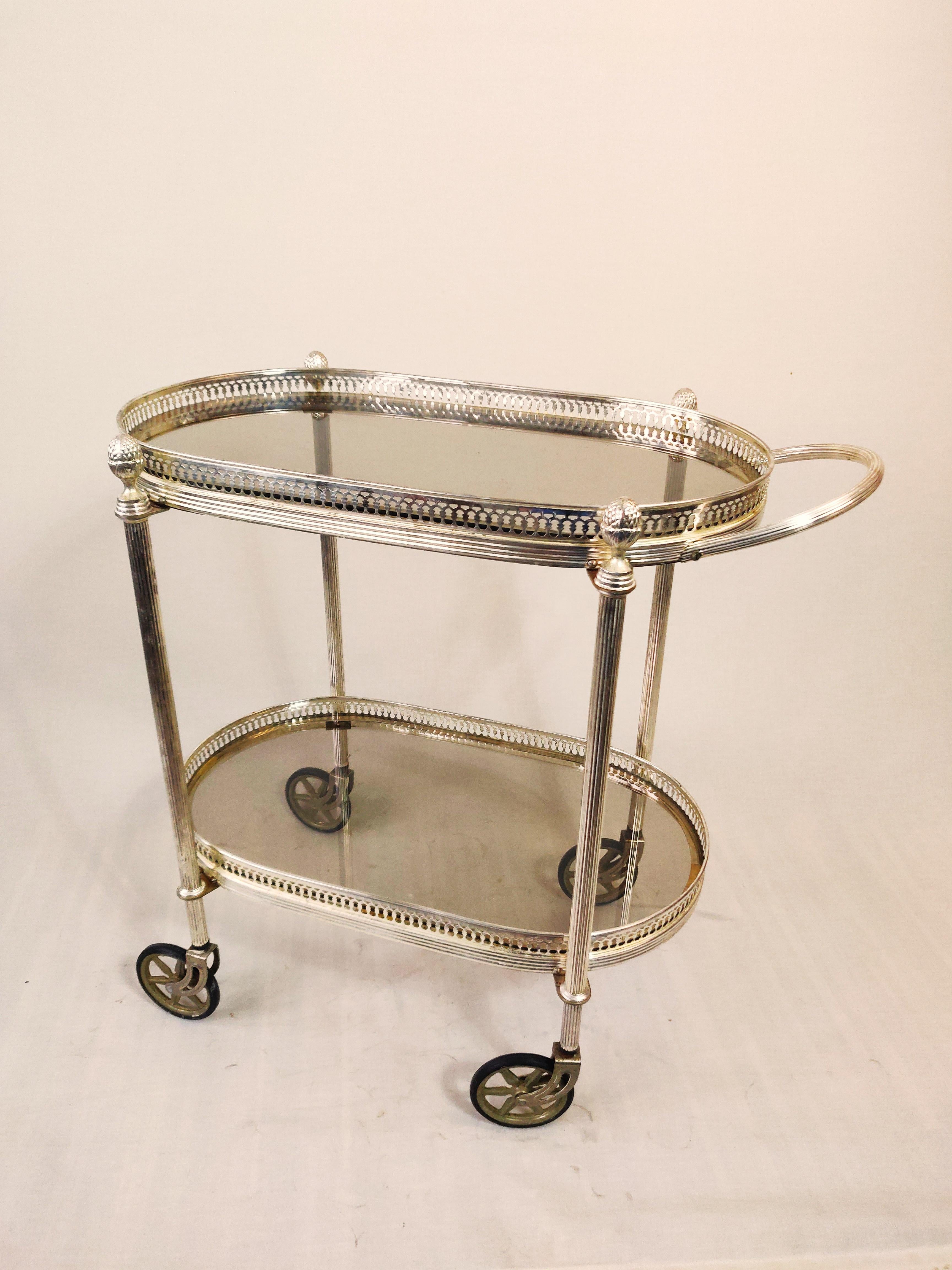 20th Century Neo classical silvered and glas drink trolley in style of Maison Jansen. For Sale