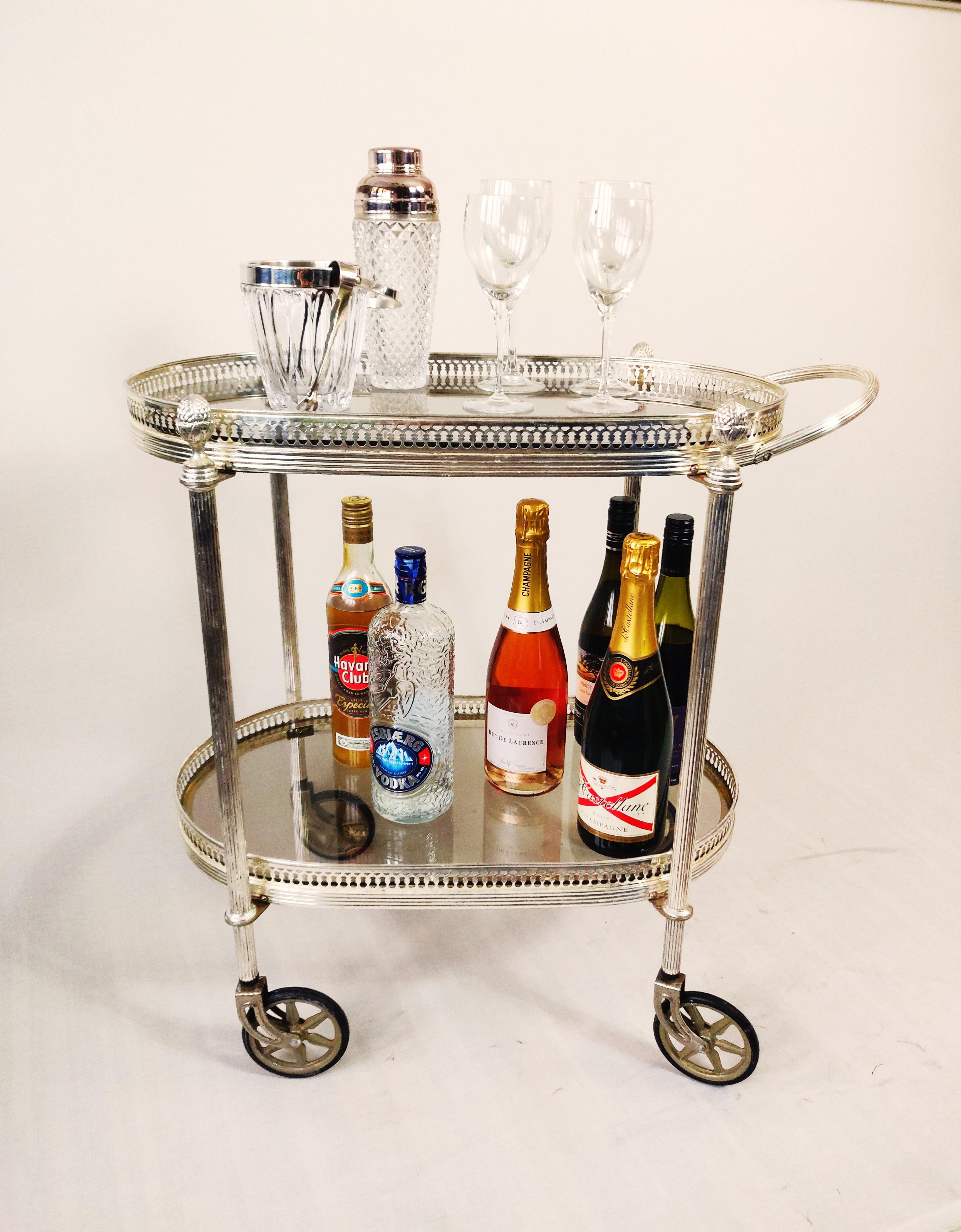 Silver Plate Neo classical silvered and glas drink trolley in style of Maison Jansen. For Sale
