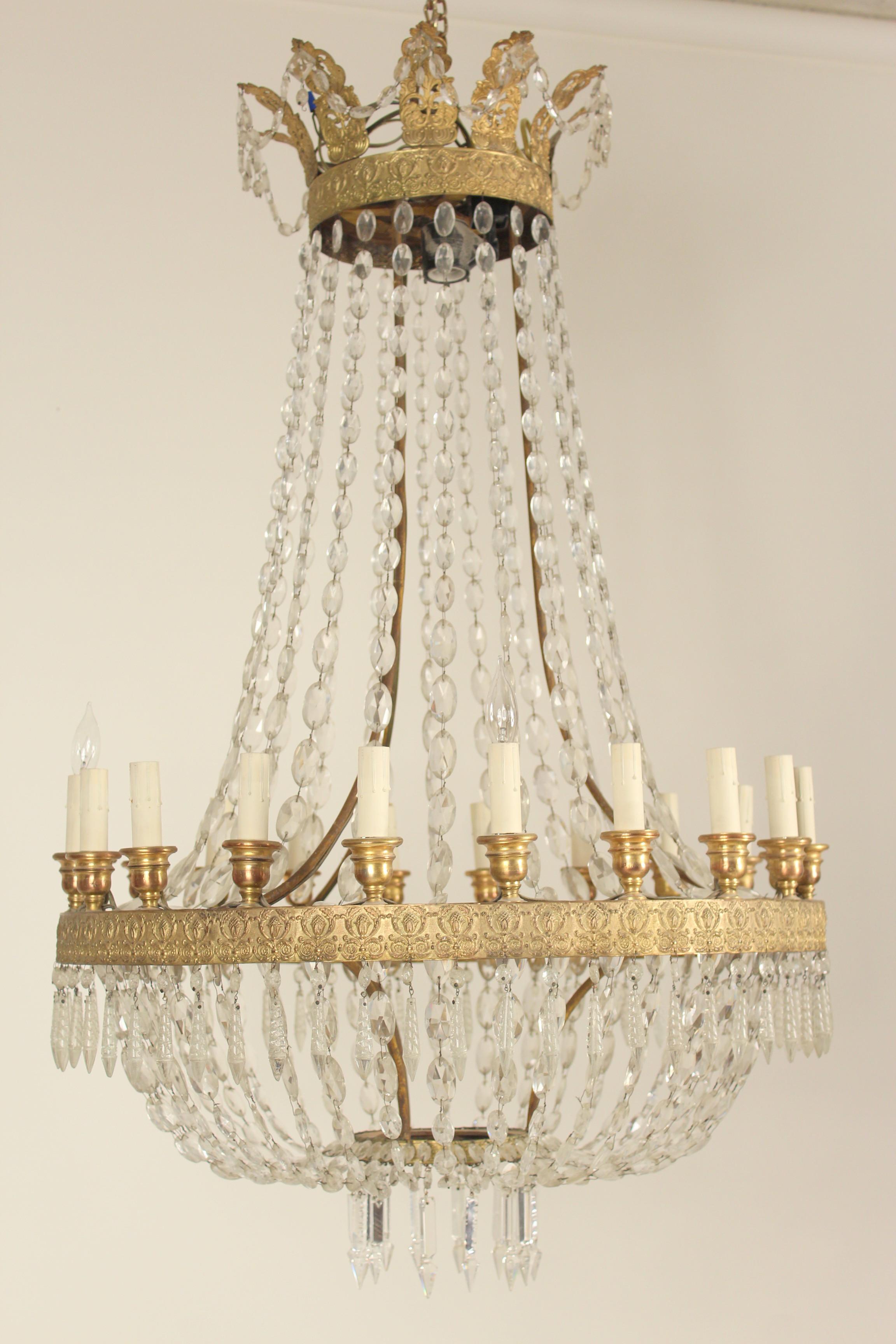 Neoclassical style gilt bronze and crystal 20-light chandelier, approximately 50-70 years old.