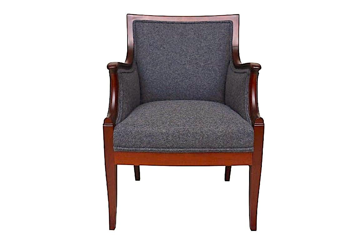 Elegant Danish modern armchair by designer Frits Henningsen with mahogany frame
and comfortable, measures: seat height of 18