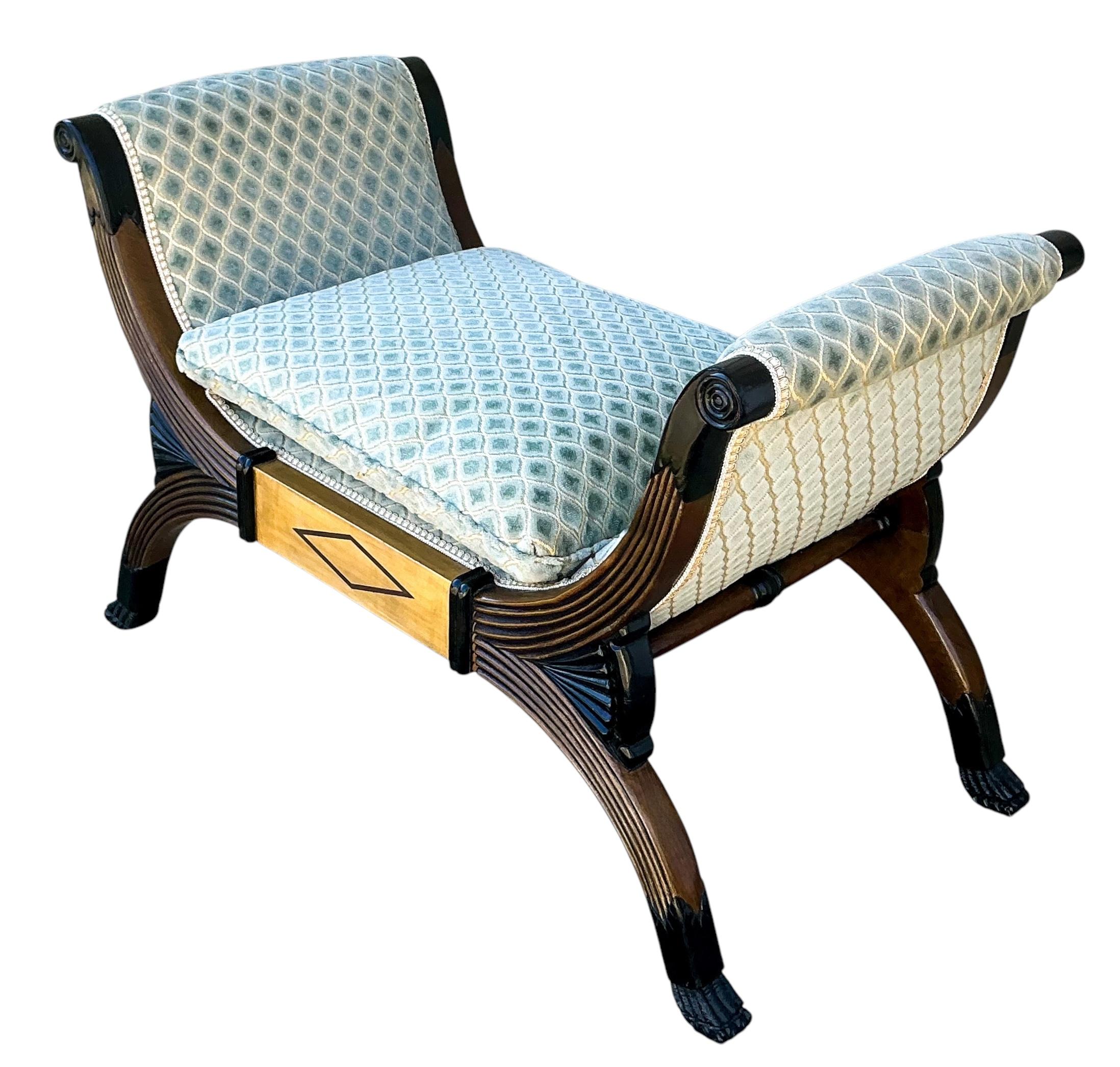 This is a timeless piece! It is a neo-classical style bench. The upholstery is a vintage celadon cut velvet that is in good condition. The bench has ebonized carved paws. The remainder is a combination of maple and walnut. It is unmarked, and the