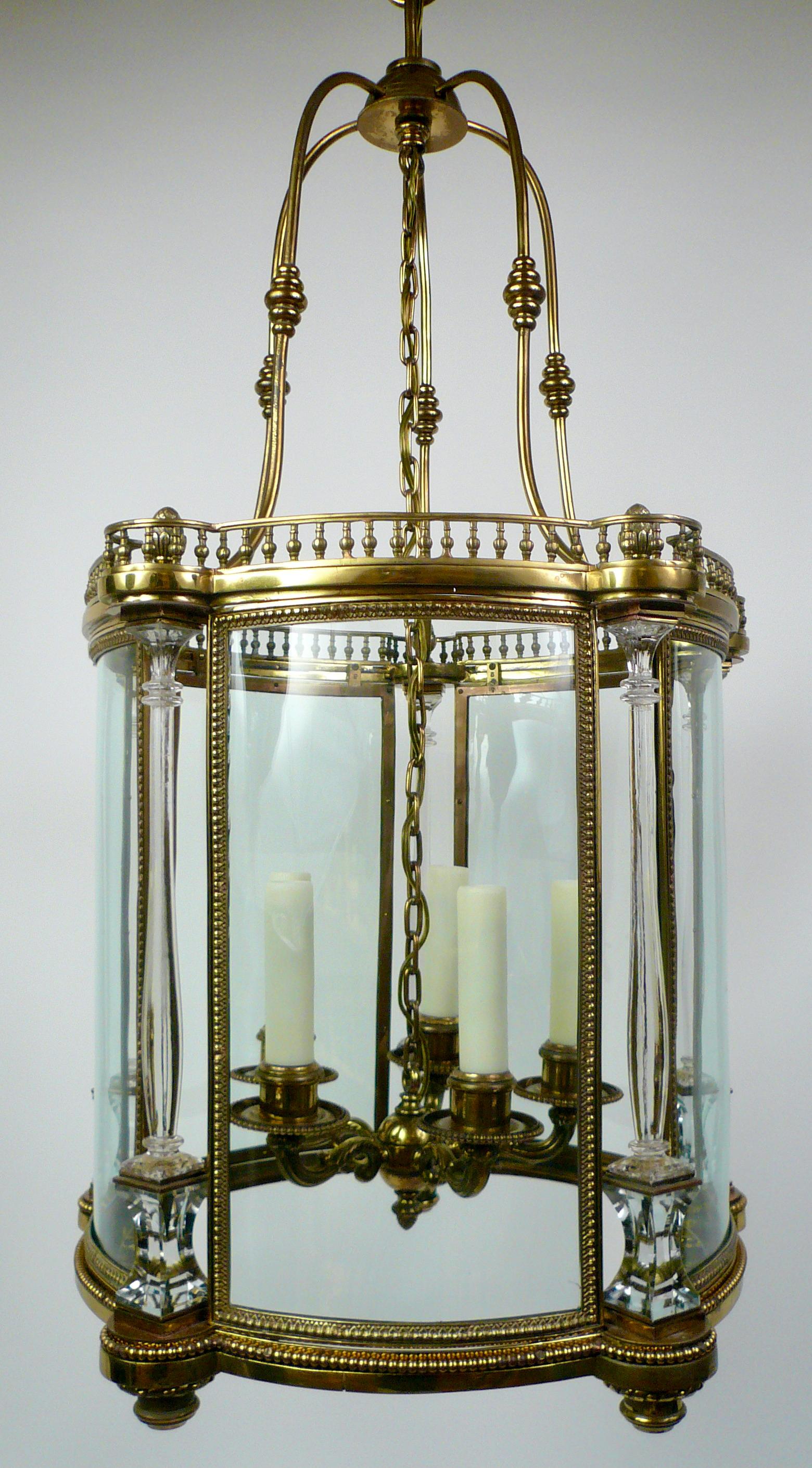 This classical style lantern is beautifully proportioned and of timeless design.
The moulded and cut crystal baluster form columns alternating with curved glass panels are set in a galleried bronze framework.