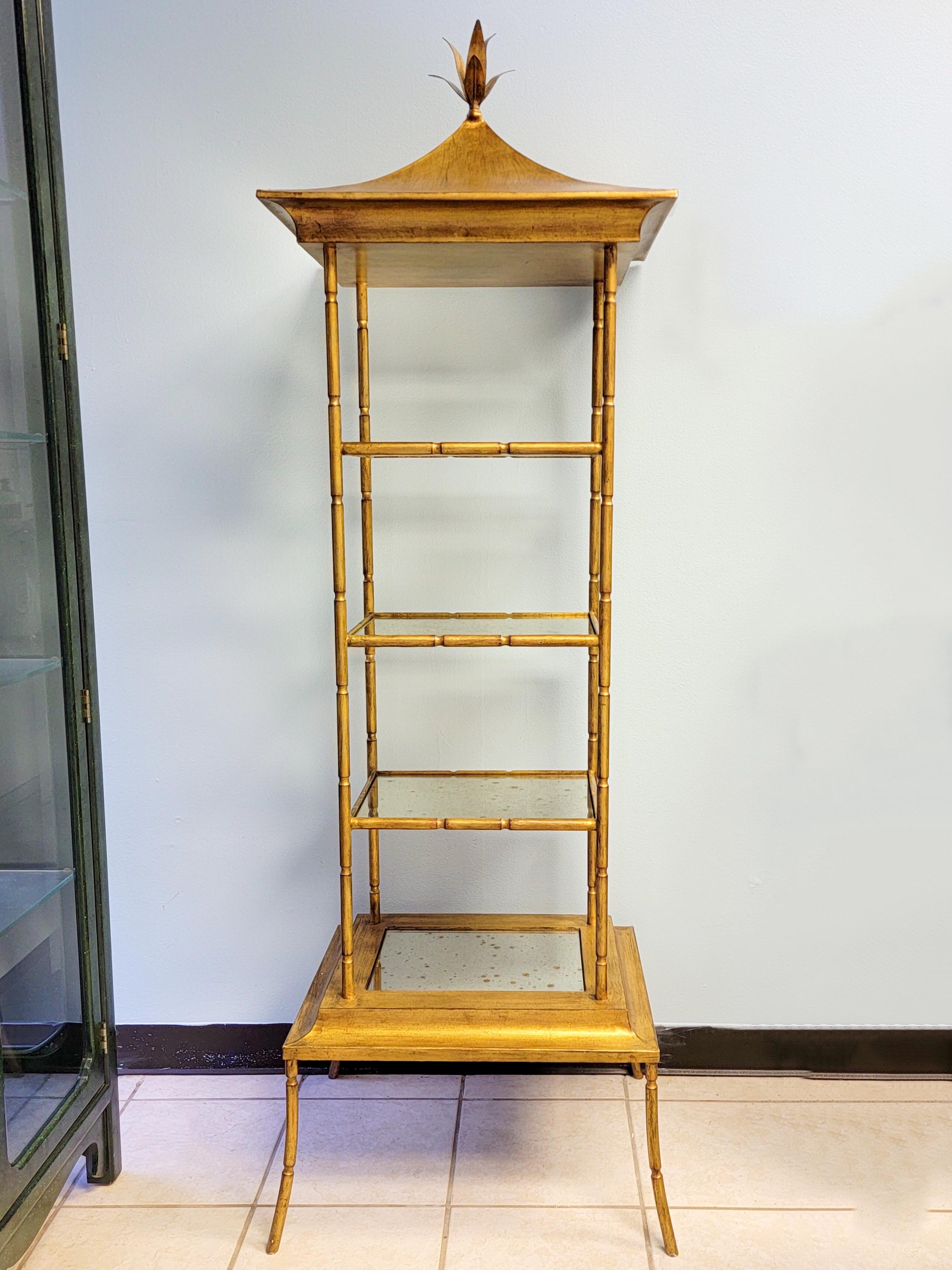 I love these! This is a pair gilt metal neo-classical style pagoda form etageres. They are in very good condition. The shelves have distressed mirror inserts. They are unmarked and are probably late 20th century.