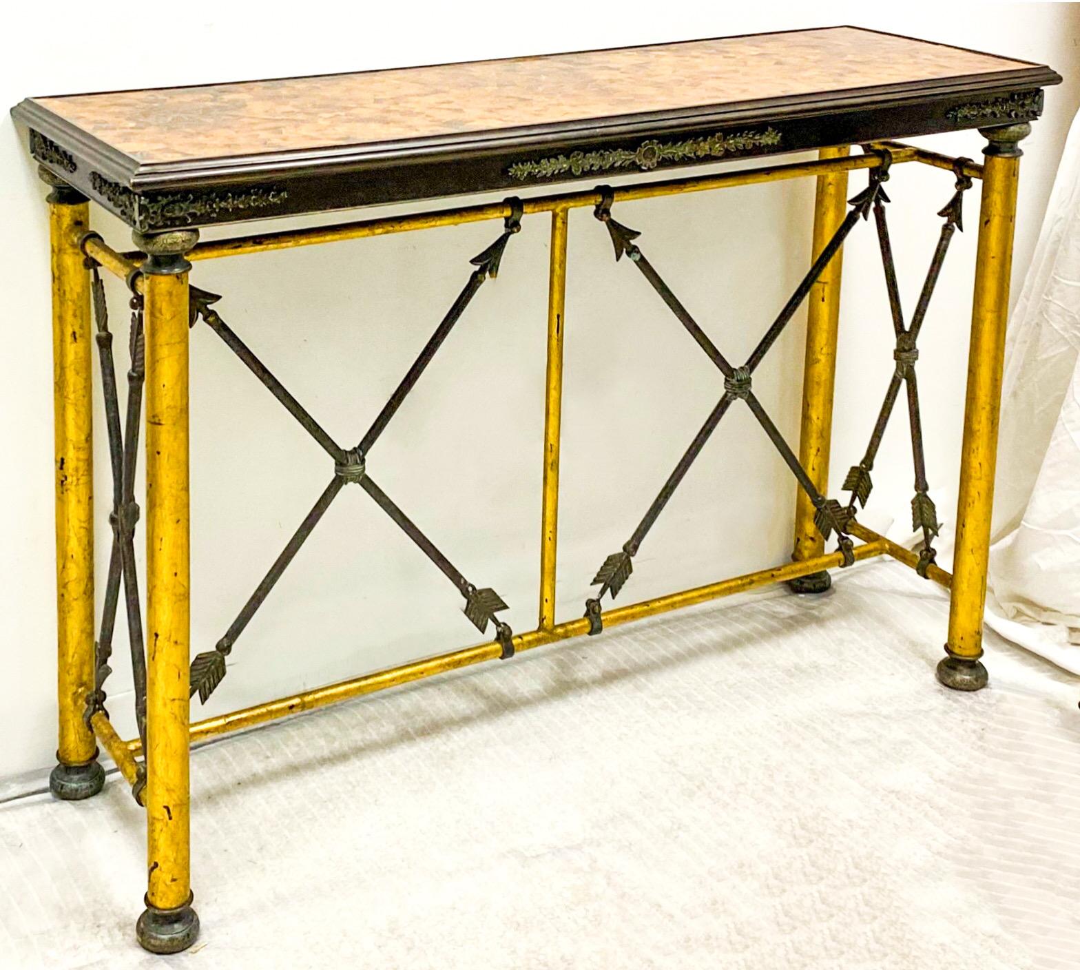 This is a wonderful late 20th century neo-classical style console table attributed to Maitland-Smith. The top has a faux tortoise finish, and the arrows are a heavy cast metal. The appointments are bronze.