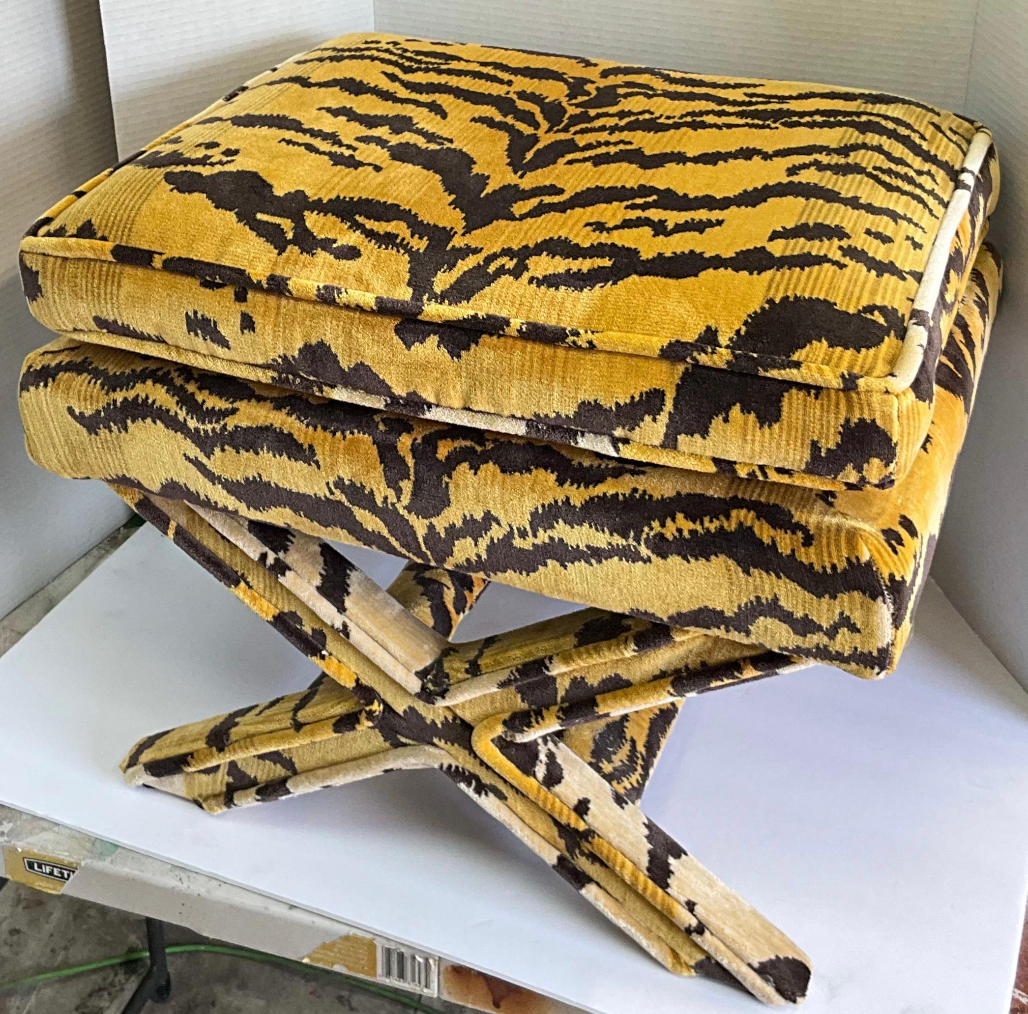 This is a 1990s x-bench upholstered in a Scalamandre upholstered tiger velvet. It shows only minor wear and is unmarked.
