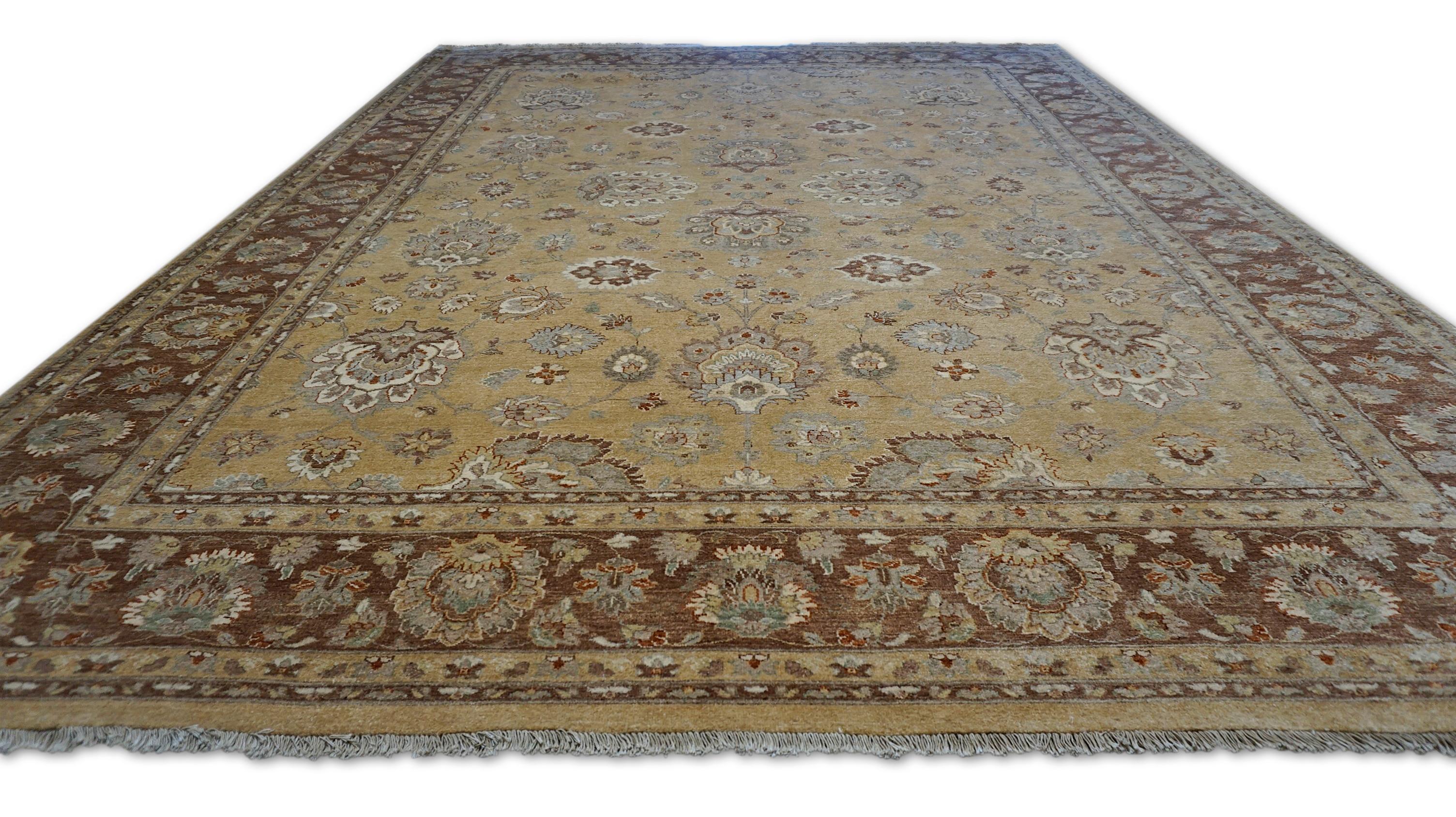 This luxurious hand-knotted Sultanabad rug, showcases a stunning combination of a Camel and Chestnut. Drawing inspiration from classic Persian designs, this piece features intricate floral and vine motifs, including stylized palmettes, lotus