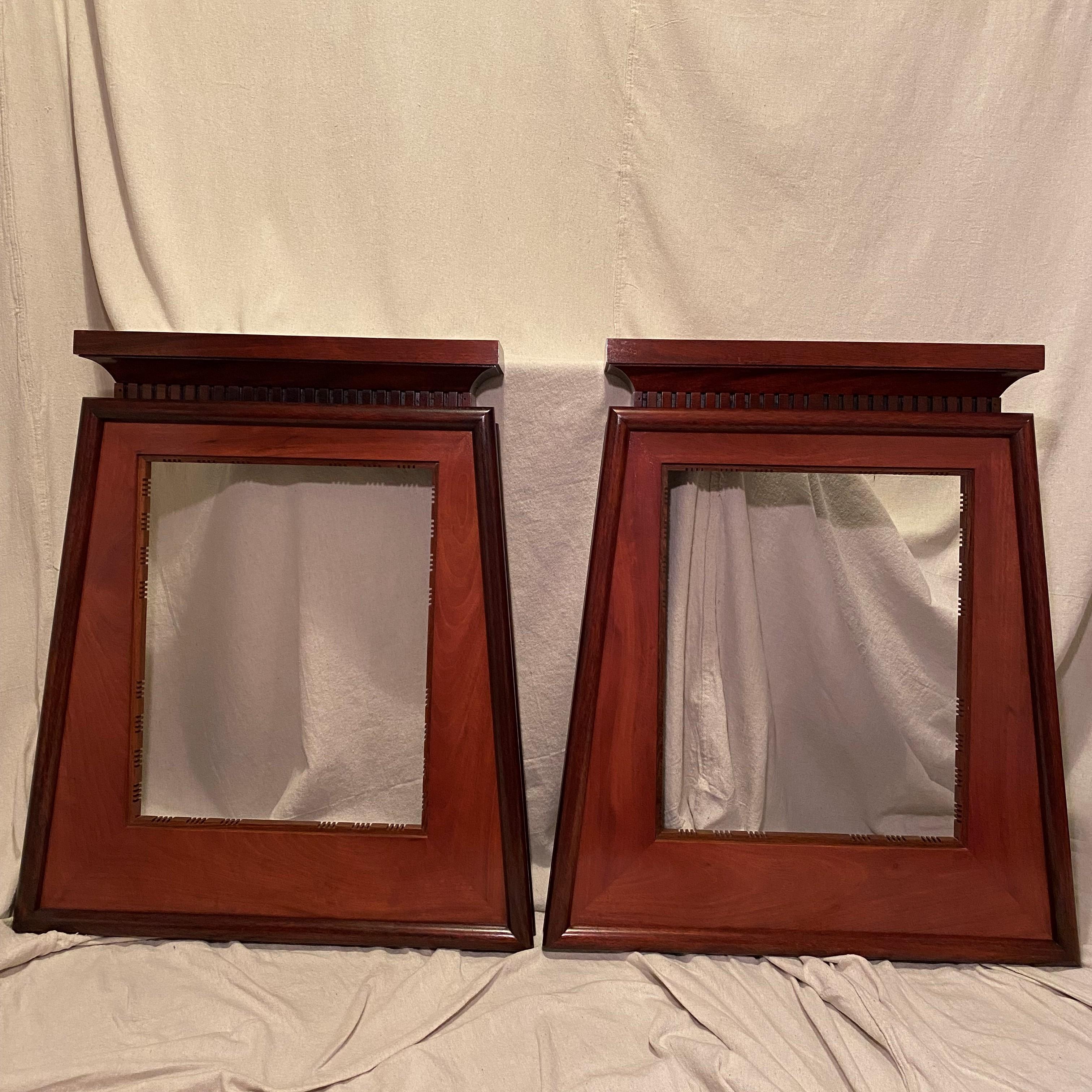 Two (of four) designed and handmade frames by Dana Nicholson at Altura Studio in New York. Solid Mahogany and rosewood assembled in a heavy torsion box method. Custom cast brass fittings for hanging and for supporting the removable mahogany art
