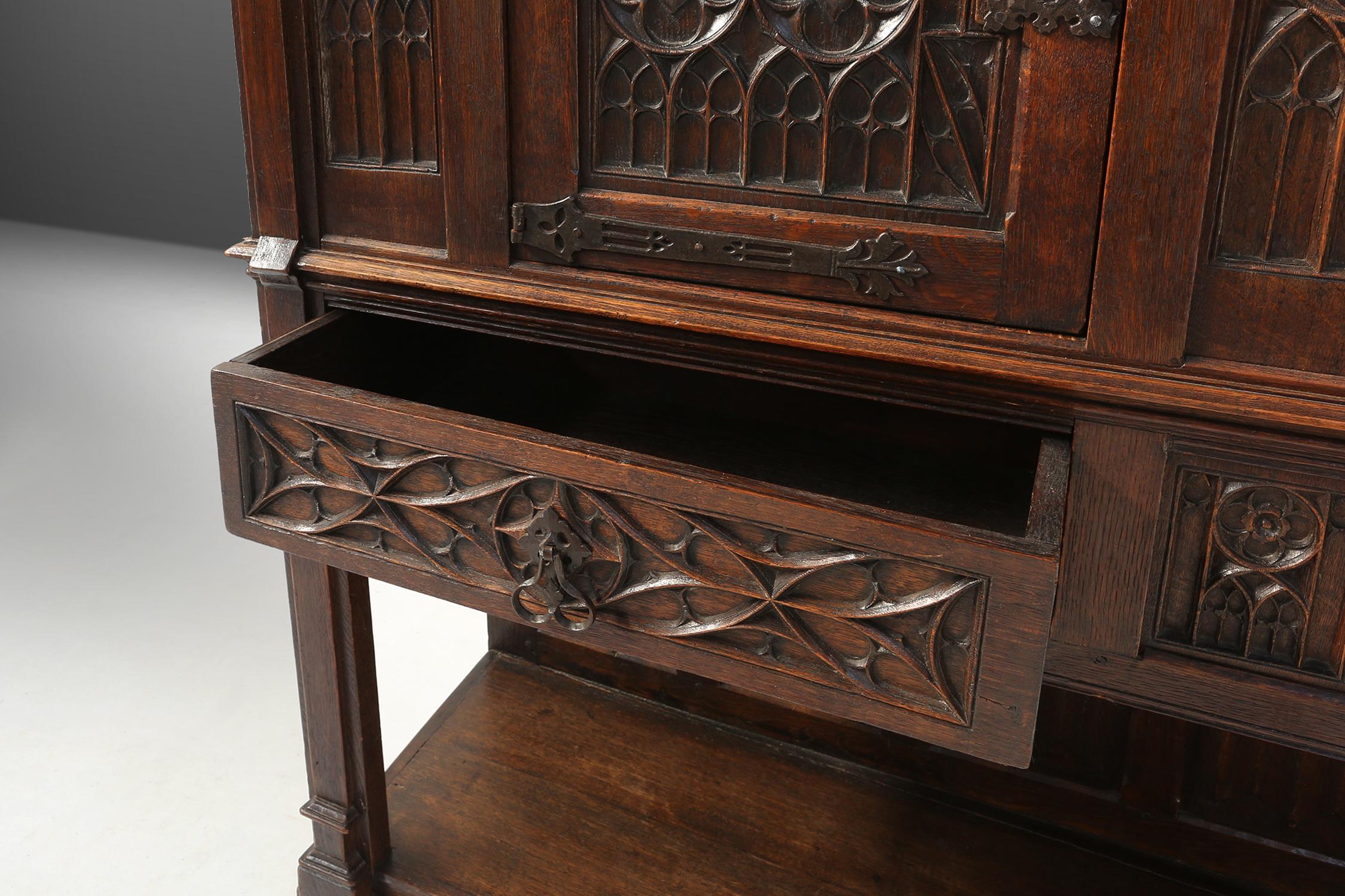 Neo-gothic cabinet in oak with rich decorations and hidden storage, France, 1850 For Sale 5