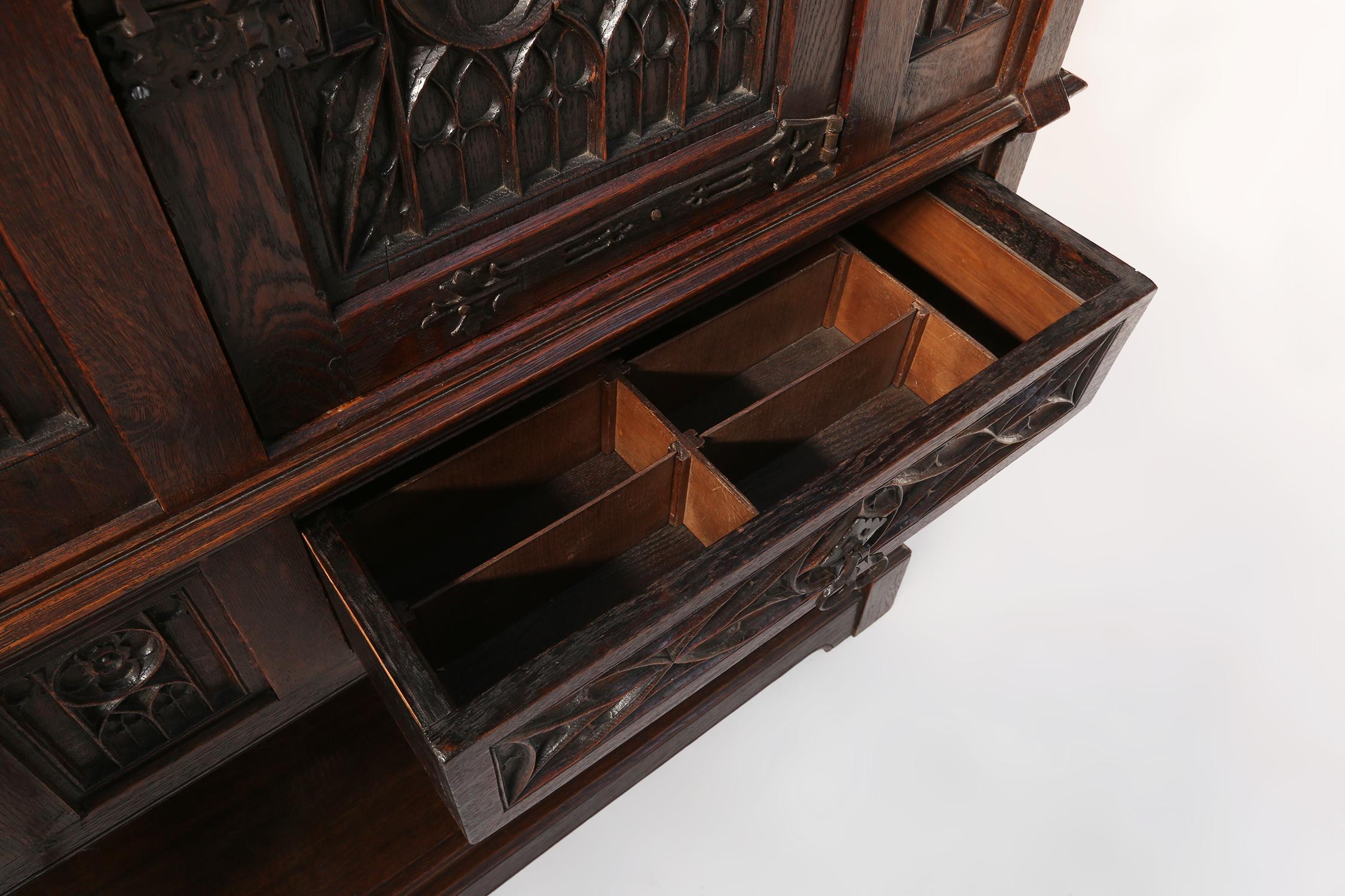 Neo-gothic cabinet in oak with rich decorations and hidden storage, France, 1850 For Sale 6