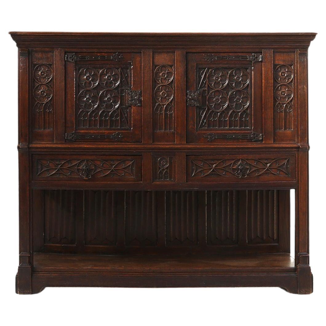 France / 1850 / cabinet / oak / neo-gothic / antique

Oak neo-gothic cabinet/ highboard with 2 doors and 2 large drawers with beautiful original brass hardware, hand crafted in France, circa 1850. Made in warm dark oak wood with typical neo gothic