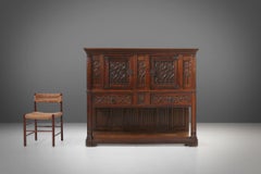 Neo-gothic cabinet in oak with rich decorations and hidden storage, France 1850