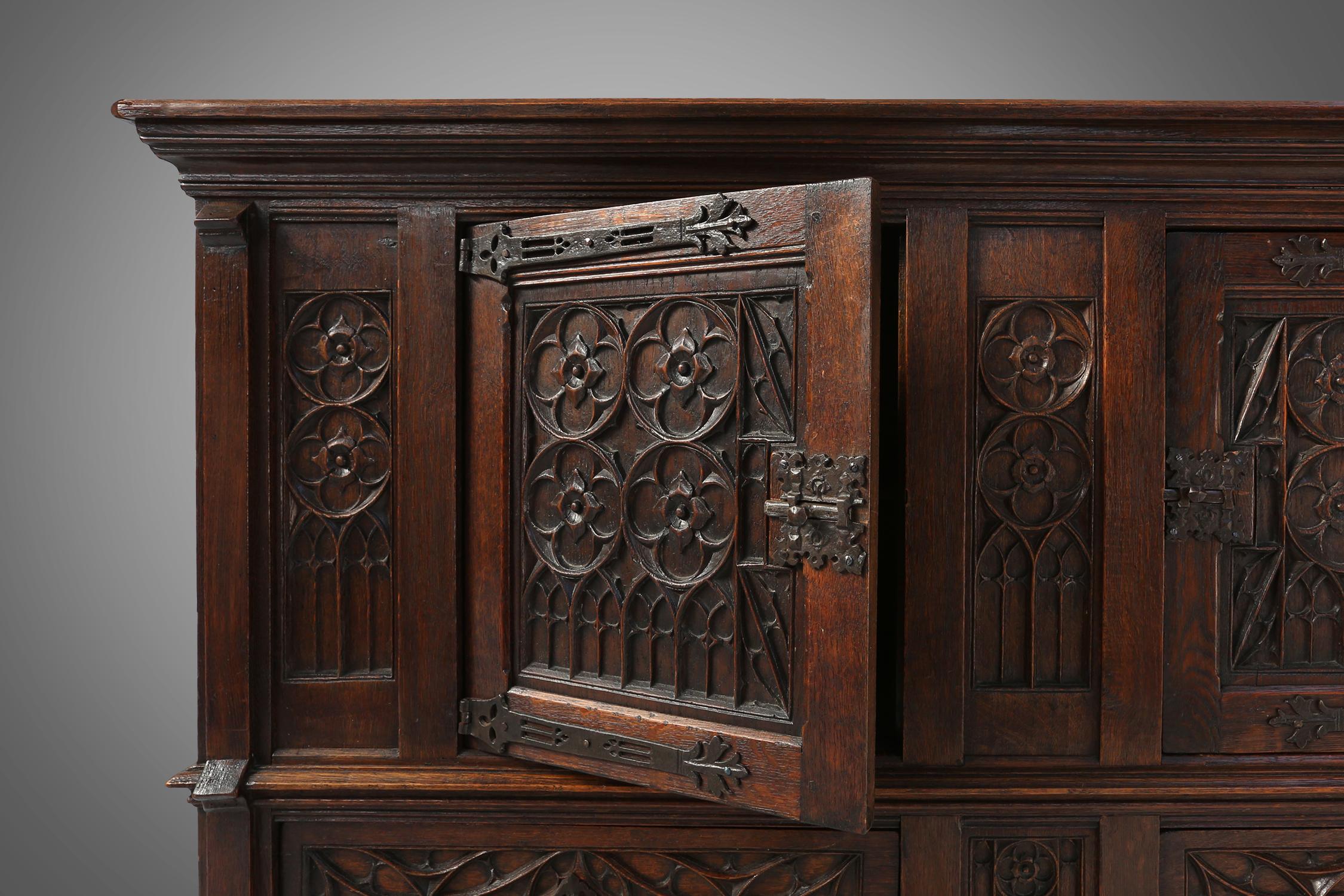 Mid-19th Century Neo-gothic cabinet in oak with rich decorations and hidden storage, France, 1850 For Sale
