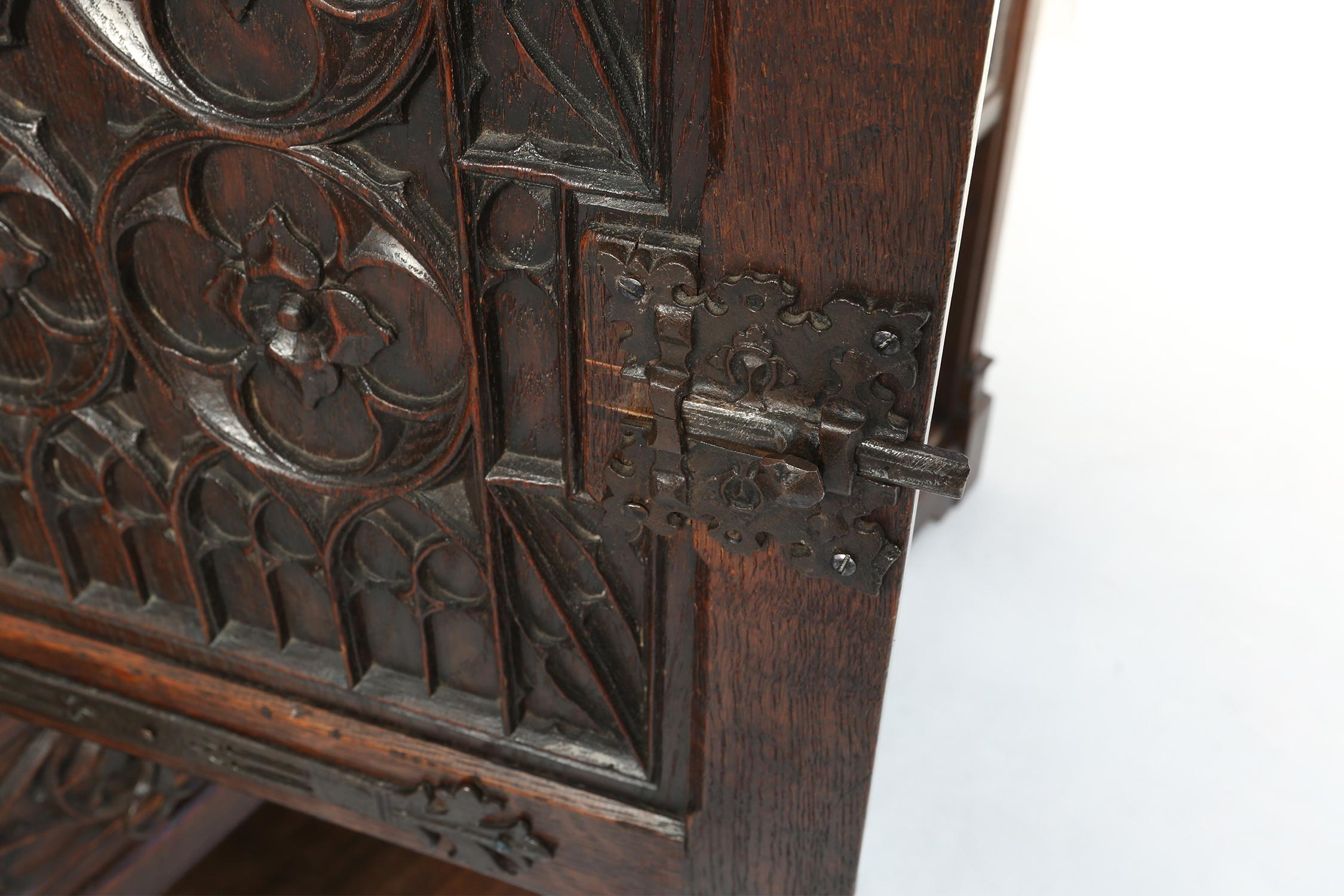 Neo-gothic cabinet in oak with rich decorations and hidden storage, France, 1850 For Sale 1