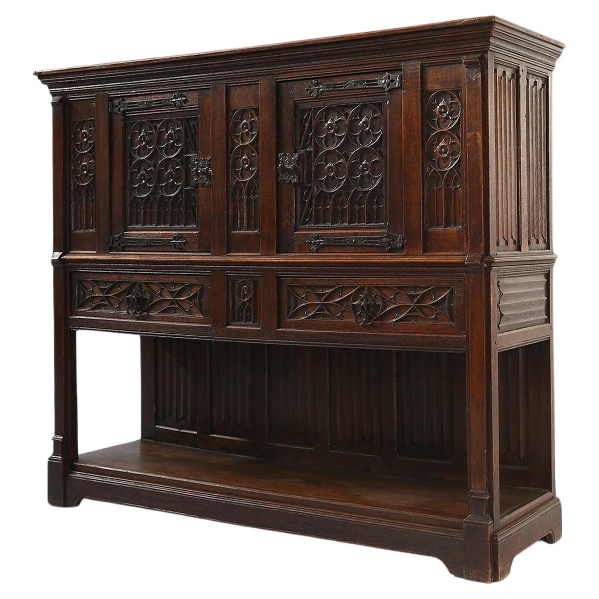 Neo-gothic cabinet in oak with rich decorations and hidden storage, France, 1850 For Sale