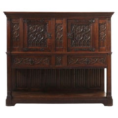Neo-gothic cabinet in oak with rich decorations and hidden storage, France 1850