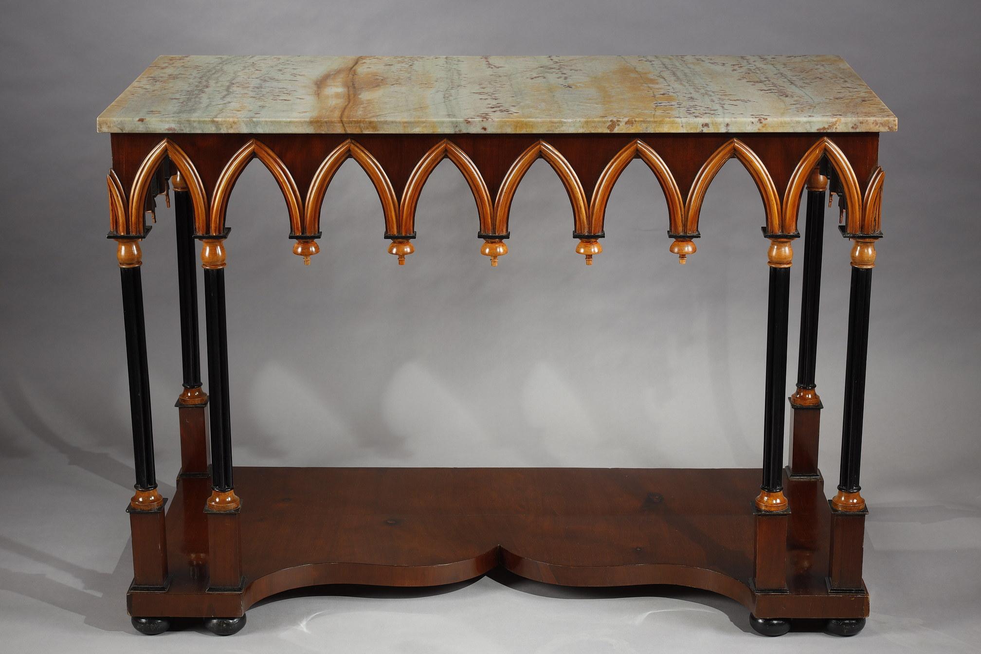 Beautiful neo-Gothic style wooden console table. The veined marble top is underlined by a succession of broken molded arches evoking gothic architecture, and rests on six four-lobed columns with a quadrangular base, resting on an accolade-shaped