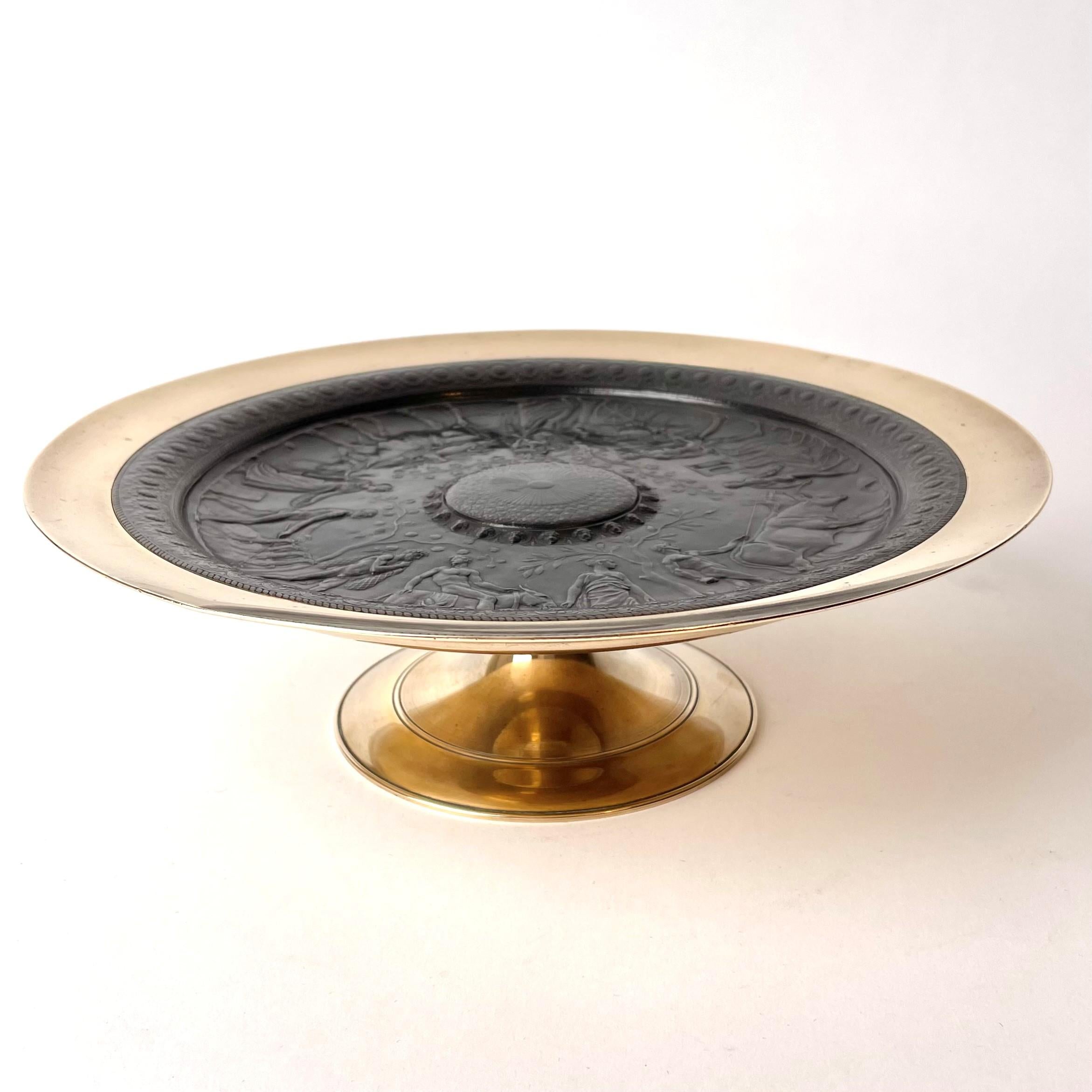 A beautiful Neo-Grec Tazza in bronze and patinated bronze, signed by the artist Ferdinand Levillain ( 1837-1905) and cast by the famous Ferdinand Barbedienne (1810-1892).

France 1860s-1870s

Wear consistent with age and use.