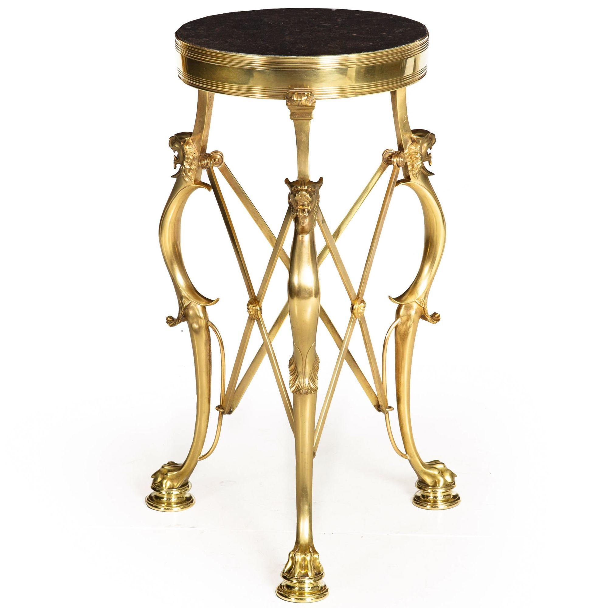 AN EXCEEDINGLY BEAUTIFUL NEO-POMPEIAN POLISHED-BRASS AND MARBLE GUERIDON
With leopard masks and raised on animal paws; France, circa 1890
Item # 402PZW06W

This gueridon table is a fine example that reflects the Neo-Pompeian style of antiquity. Its