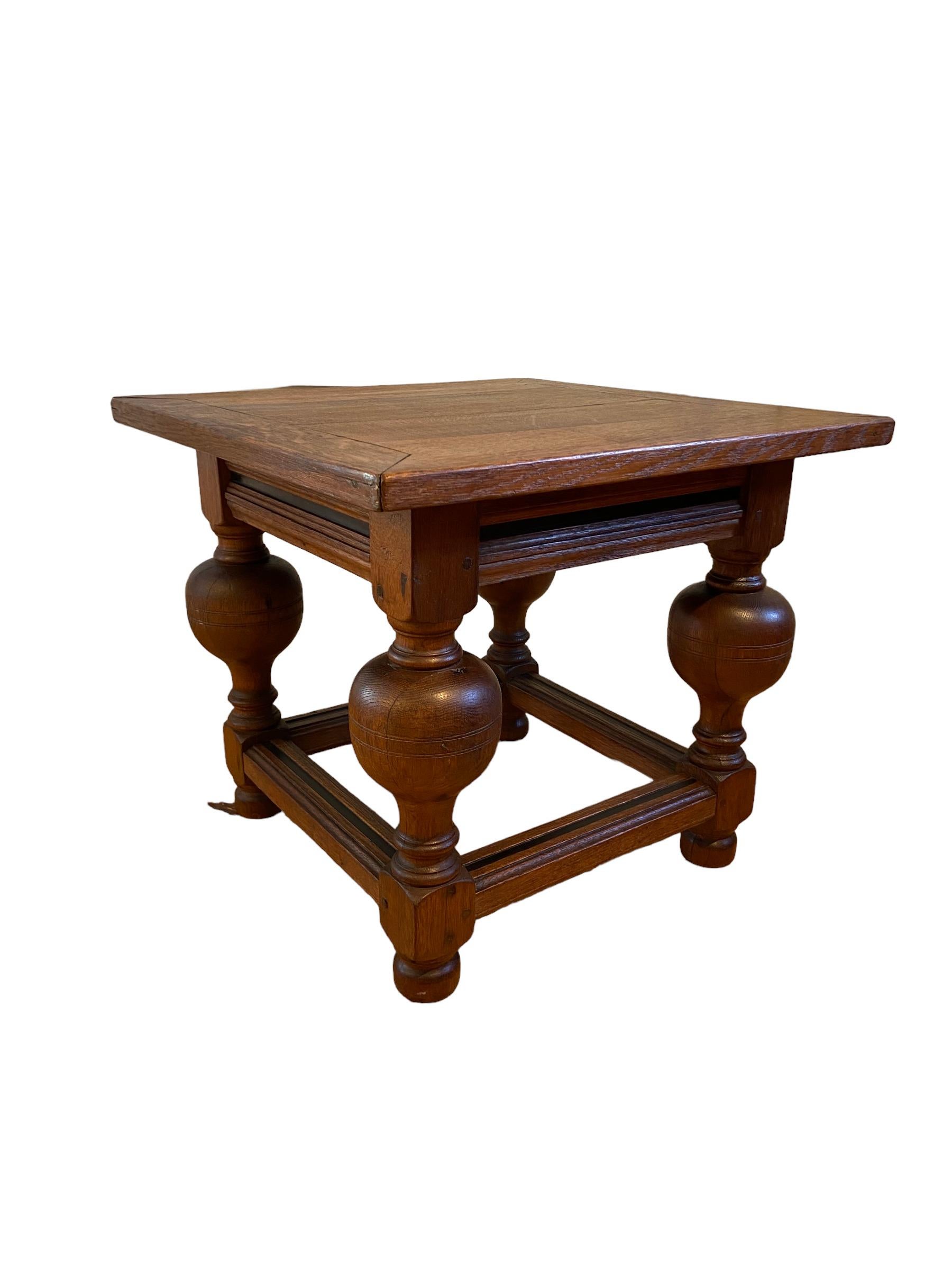 Neo-renaissance coffee table made in Holland. Oak wood with blackened accents. Approx 1900. Equipped with one blind drawer. This antique object is in a good condition but it shows sign of age.