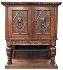 Neo-Renaissance oak cabinet with lion heads