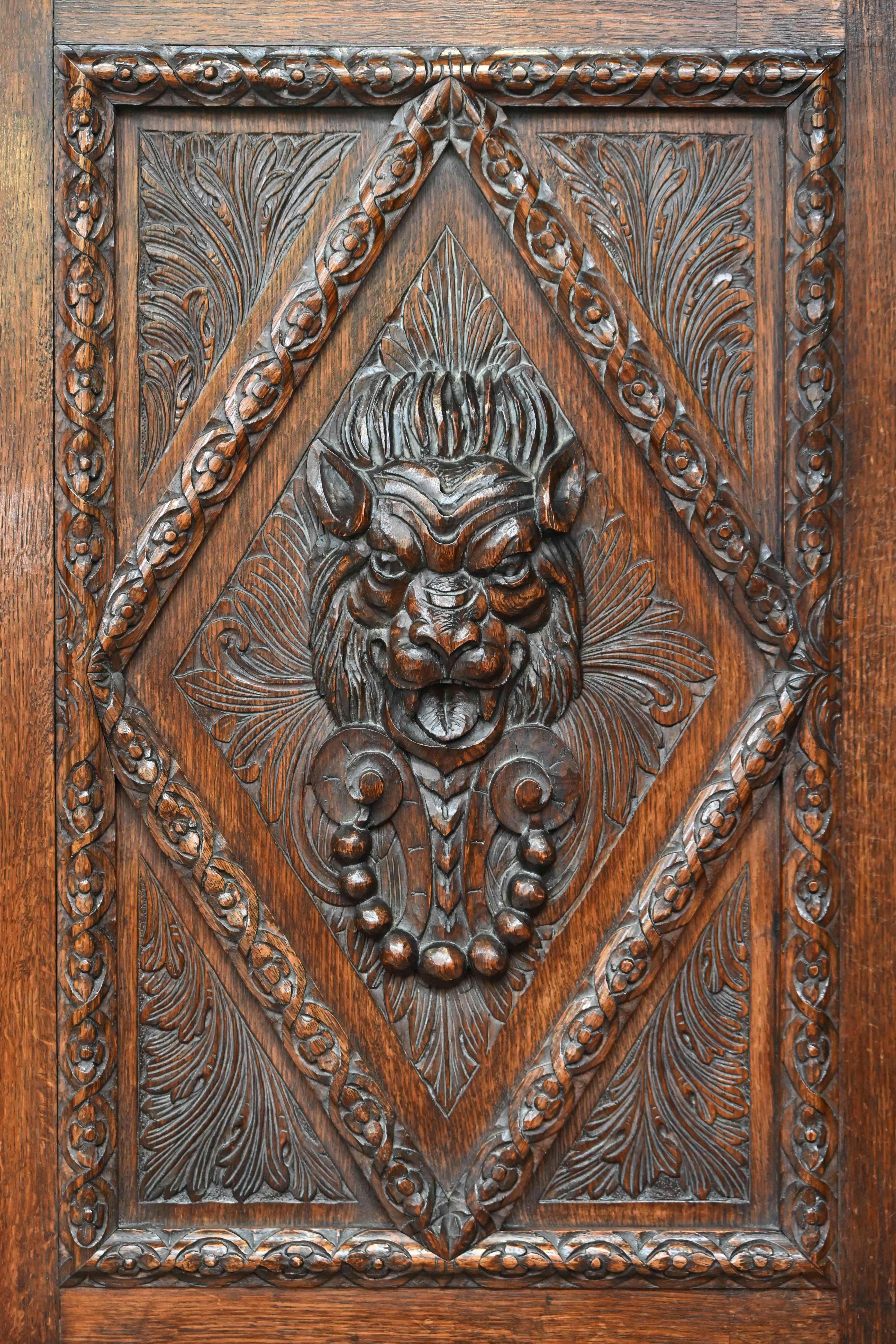 Belgian Neo-Renaissance oak cabinet with lion heads For Sale
