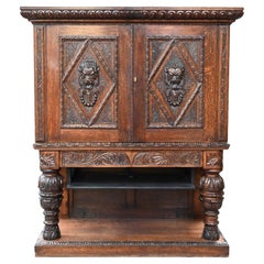 Neo-Renaissance oak cabinet with lion heads