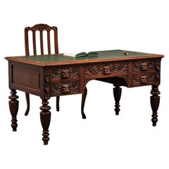 Neo-Renaissance oak writing desk with mascarons