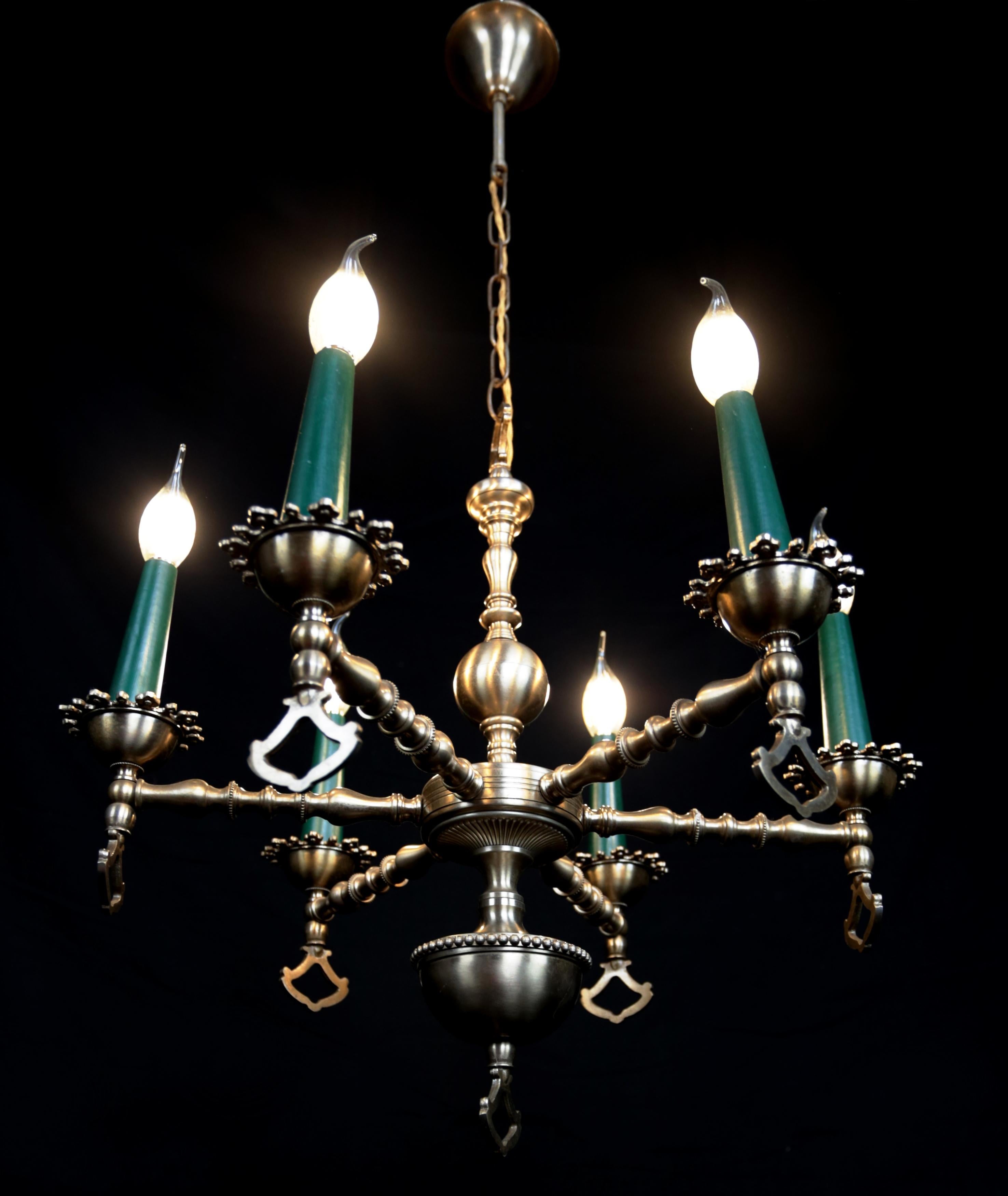 Neo-Renaissance six-armed chandelier

Quality chandelier made of patinated brass in Renaissance style. The chandelier is restored: a new old-style power cord with fabric braiding in gold color. New internal wiring. The chandelier is for 6 candle