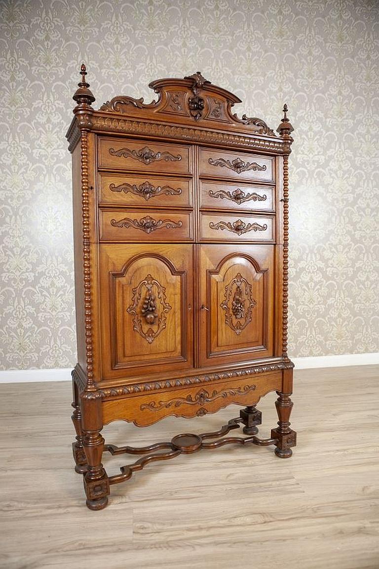 Renaissance Revival Walnut Cabinet Circa 1900 in Light Brown

Rare, exquisite and unique - these words can surely be used to describe this article of furniture.
In the past, cabinets were used for storing important documents, coins and other