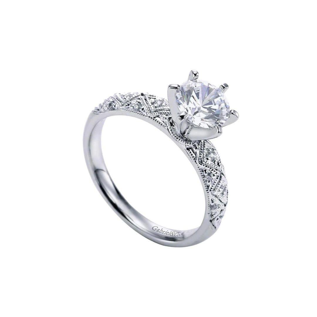 Neo Victorian Style Solitaire Engagement Ring in 14k White Gold.﻿ Center natural round brilliant cut diamond weighs 0.75ct, I color, I1 clarity, set in a six prong mount. Side diamonds are 0.10ctw, H color, SI1 clarity.